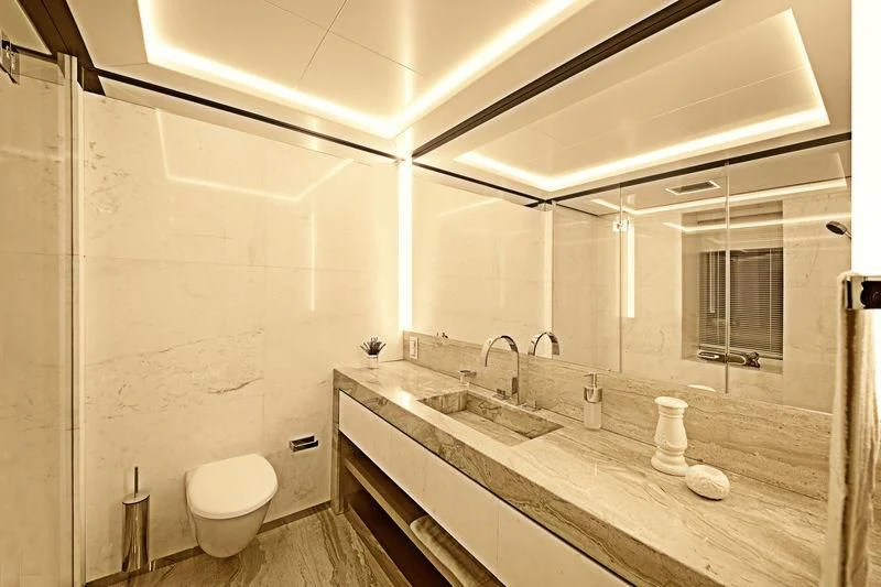 a bathroom with a large mirror aboard ICE 68 Yacht for Sale