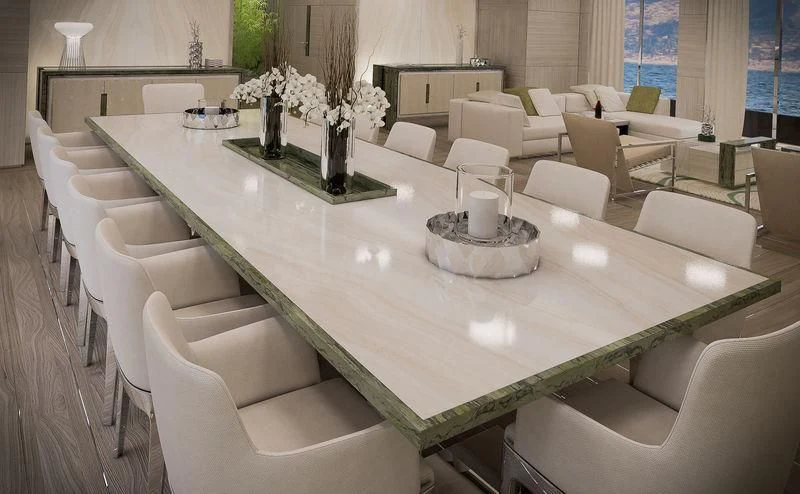 a large white table with chairs around it aboard ICE 68 Yacht for Sale
