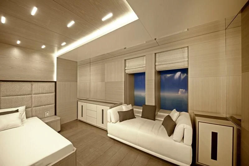 a room with a couch and a table aboard ICE 68 Yacht for Sale