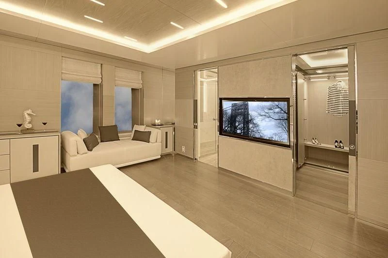 a large living room with a large screen aboard ICE 68 Yacht for Sale