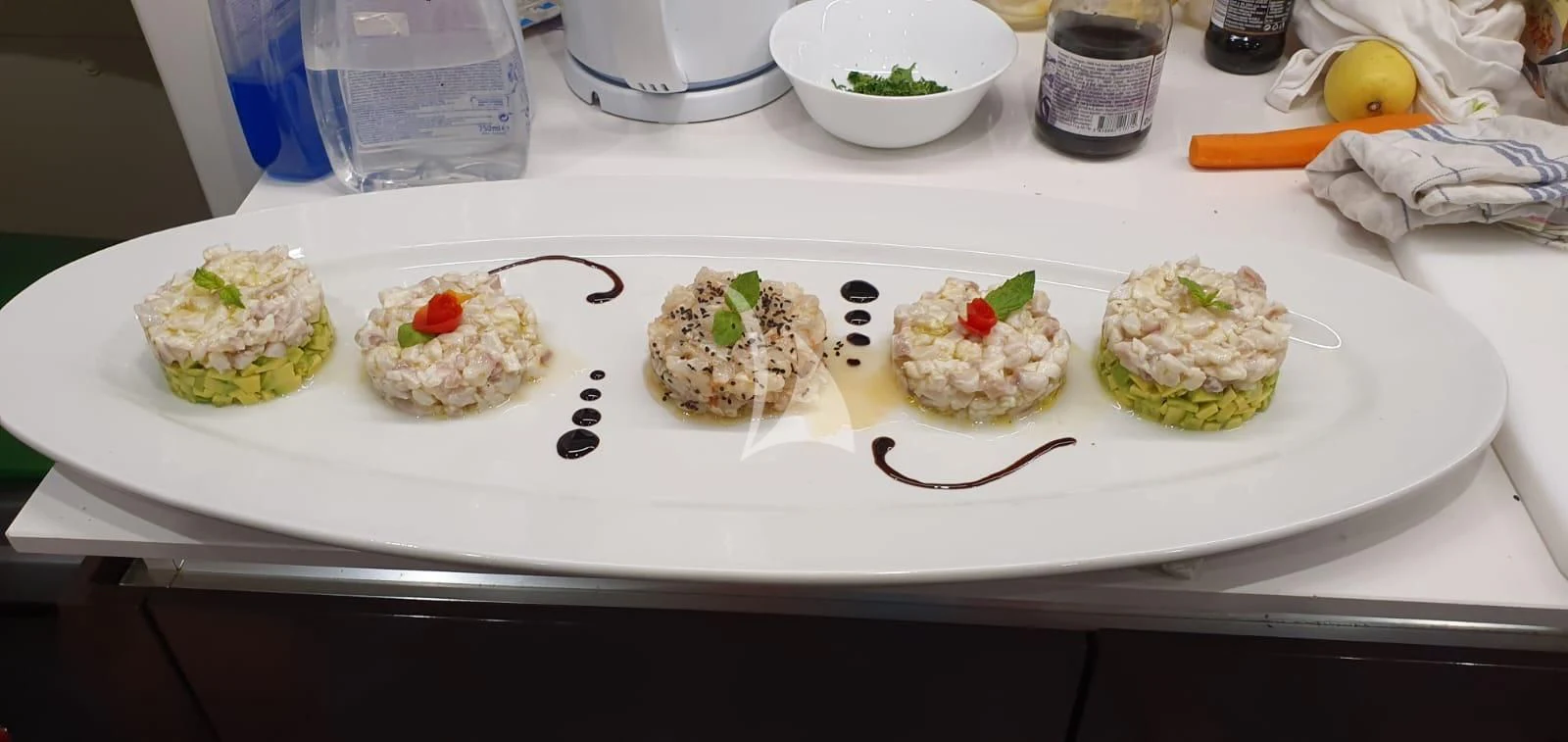 a plate of sushi aboard IVA Yacht for Sale