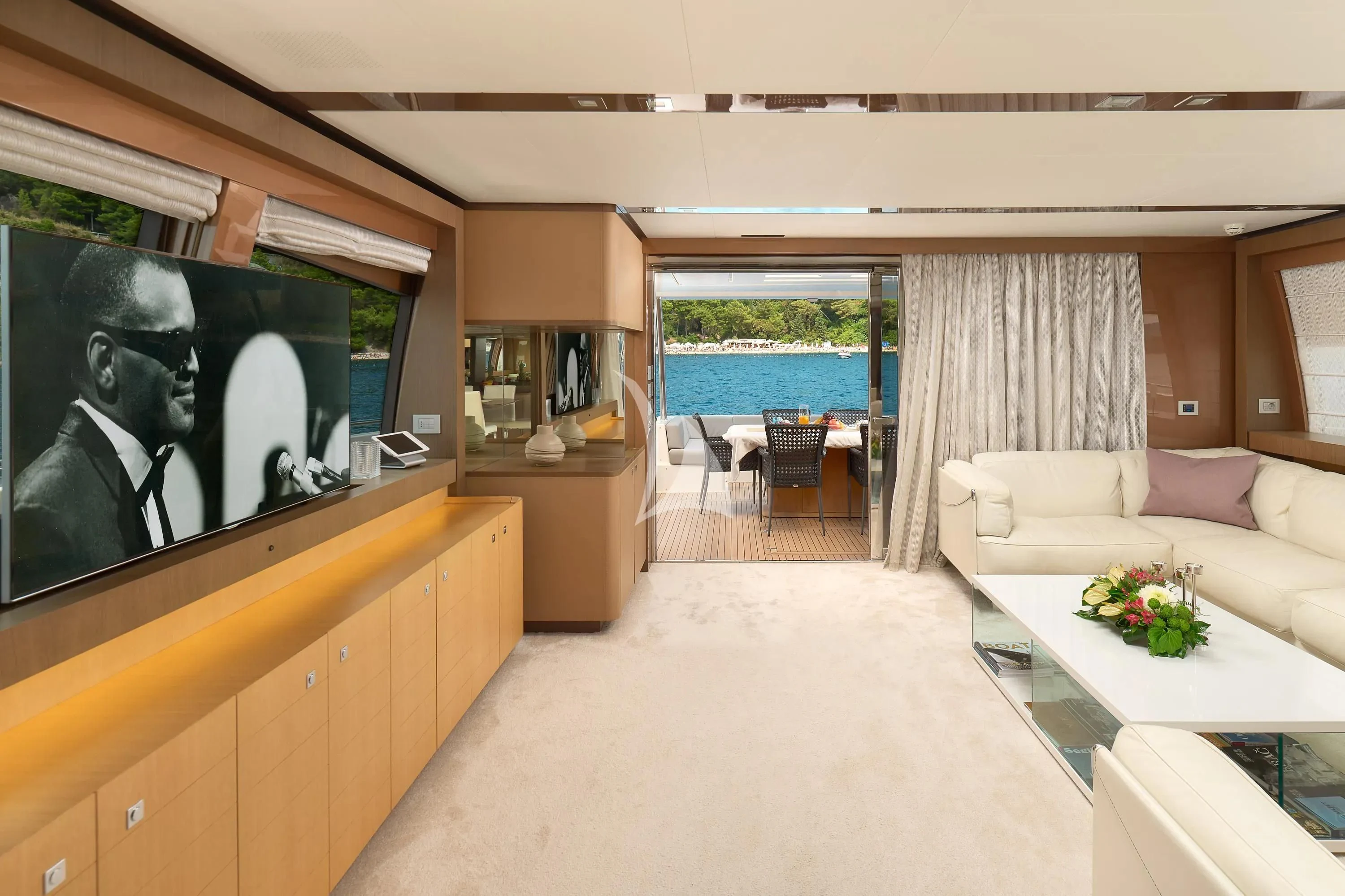 a living room with a large screen aboard IVA Yacht for Sale