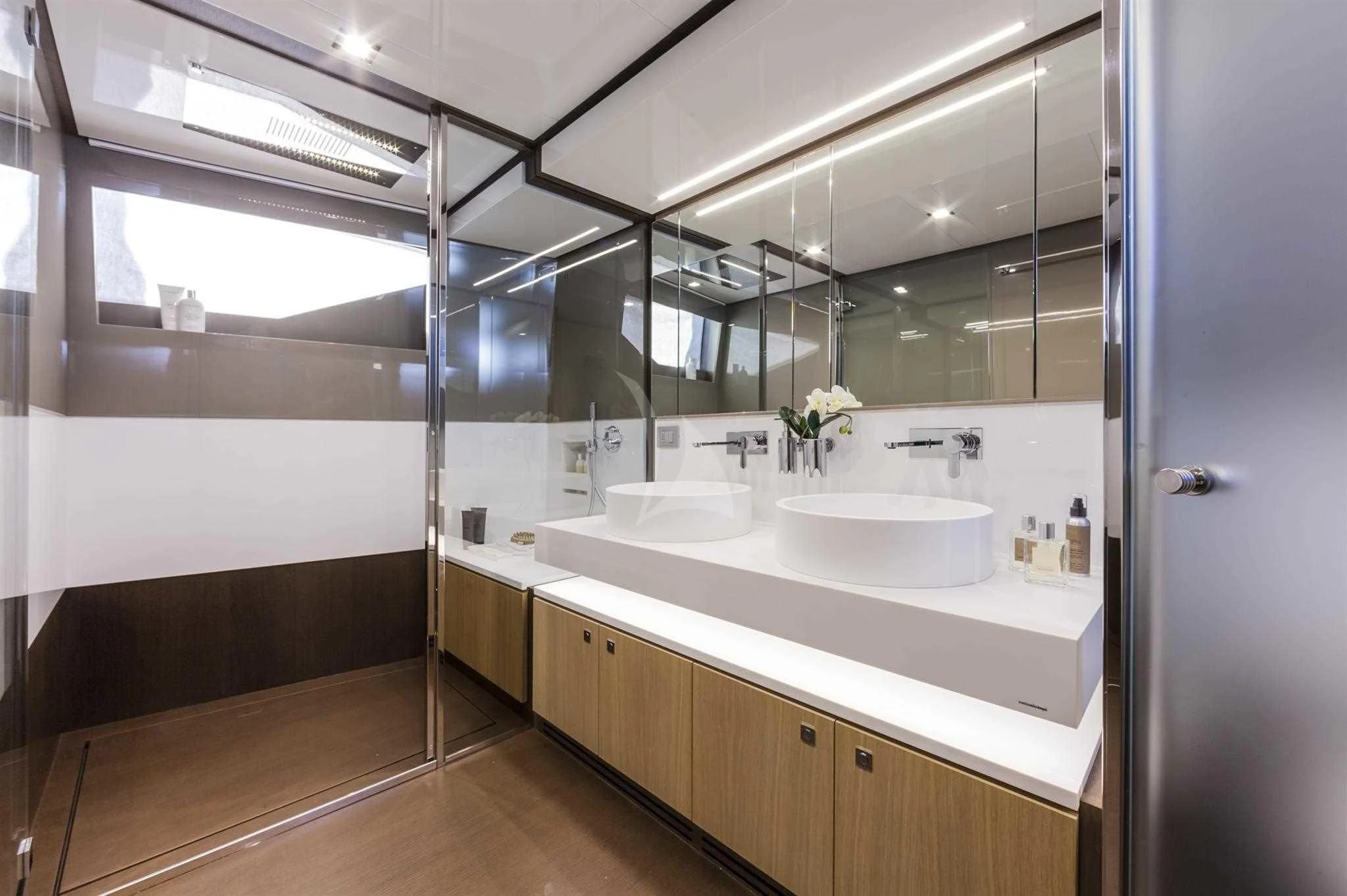 a bathroom with a large mirror aboard IVA Yacht for Sale