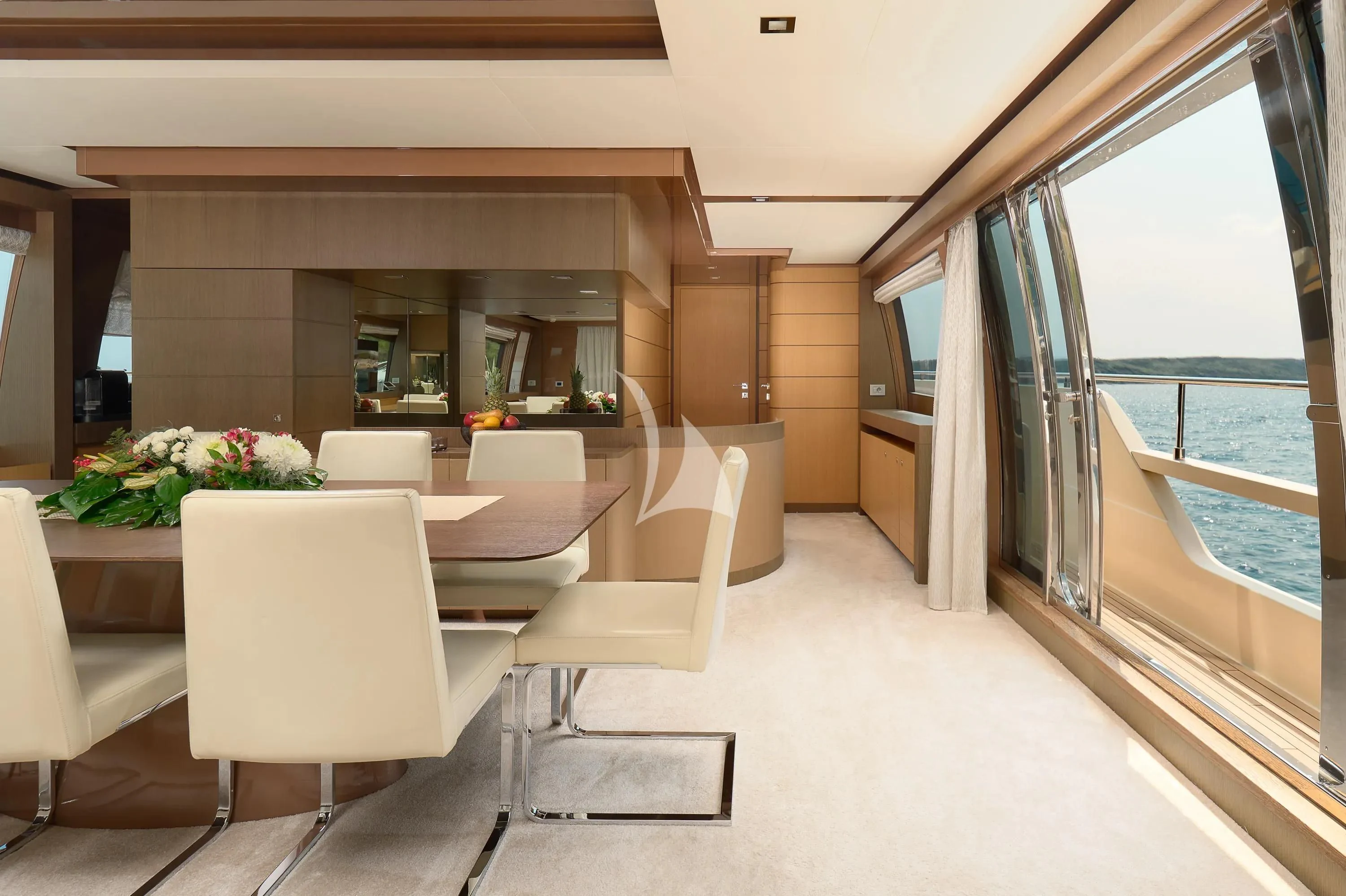 a room with a table chairs and a large window aboard IVA Yacht for Sale