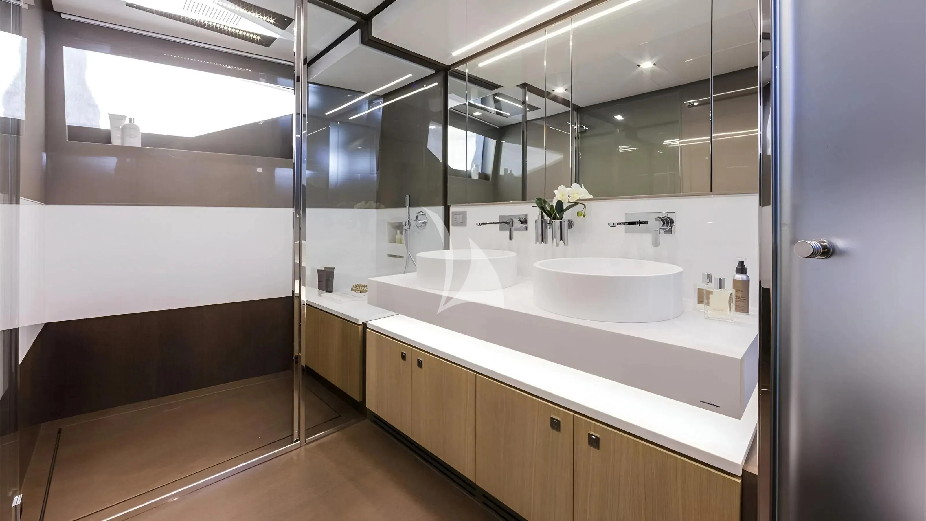 a bathroom with a sink and a mirror aboard IVA Yacht for Sale