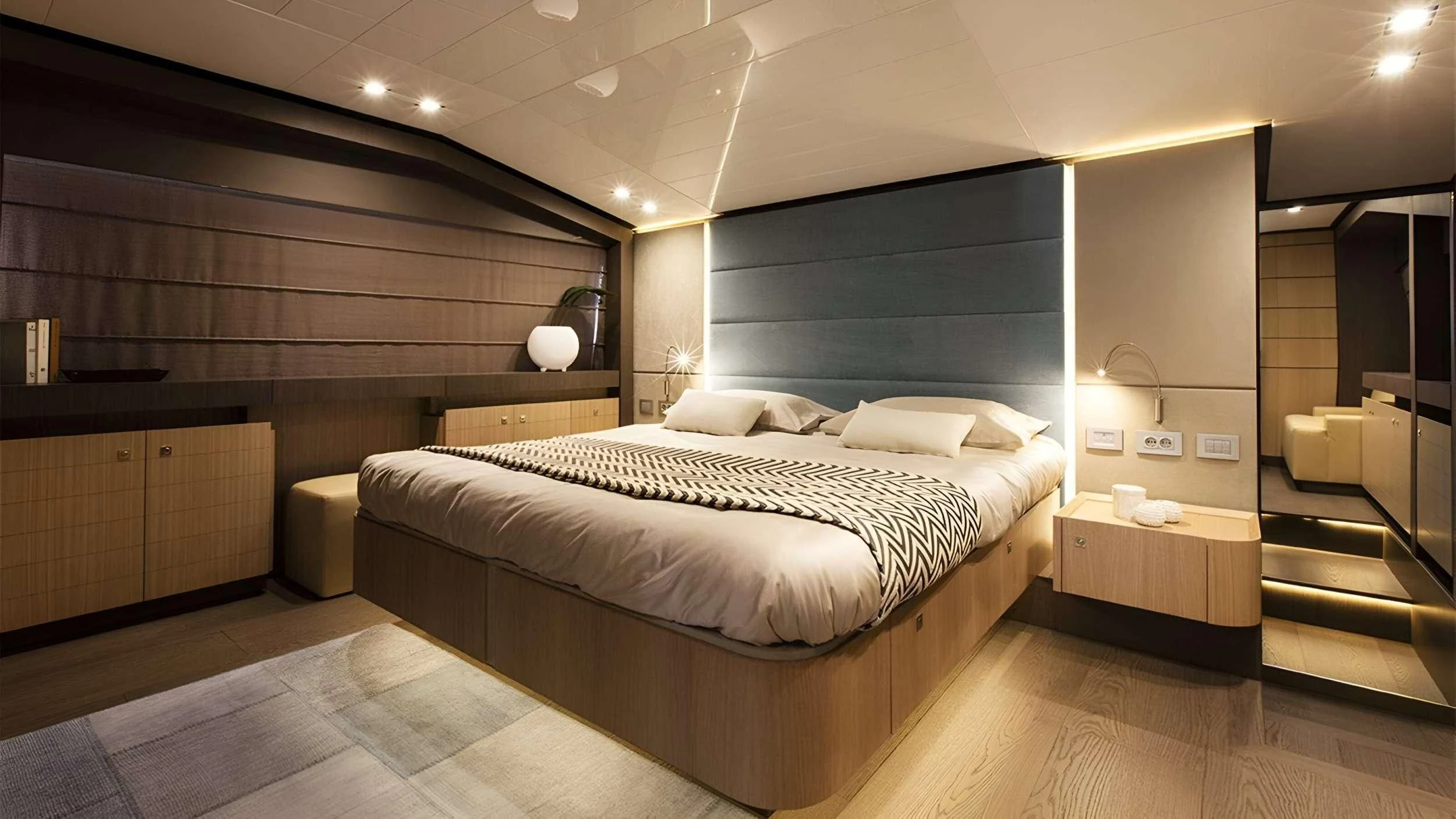 a large bedroom with a large bed aboard IVA Yacht for Sale