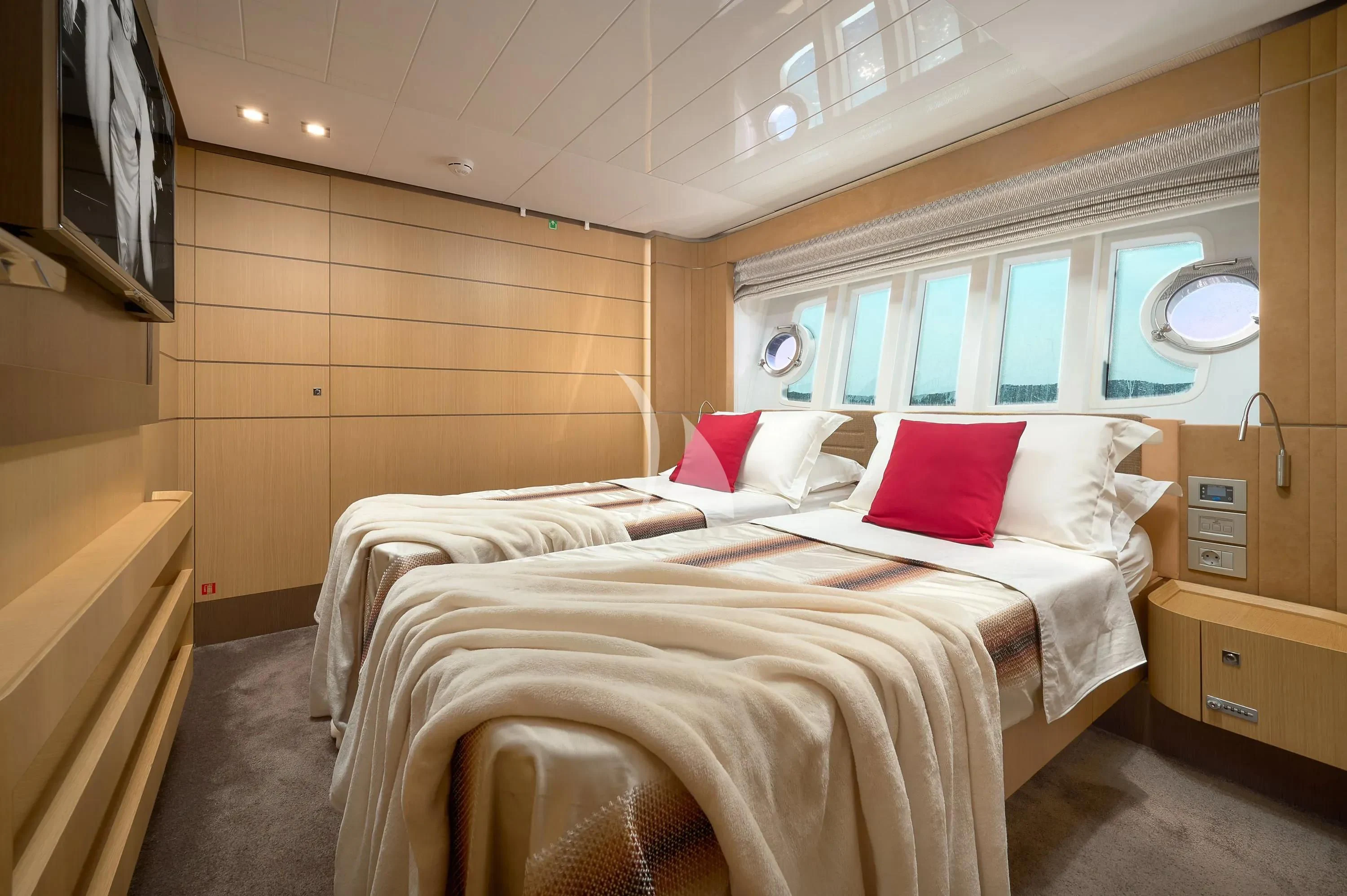 a couple of beds in a room aboard IVA Yacht for Sale