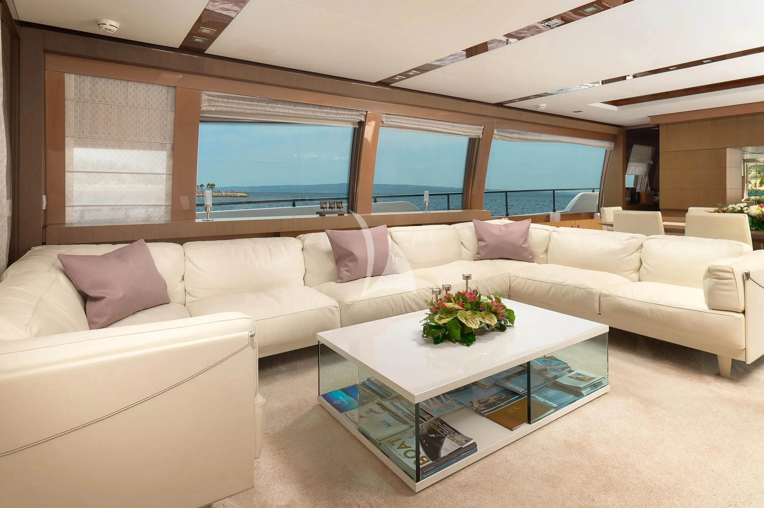 a living room with a large window aboard IVA Yacht for Sale