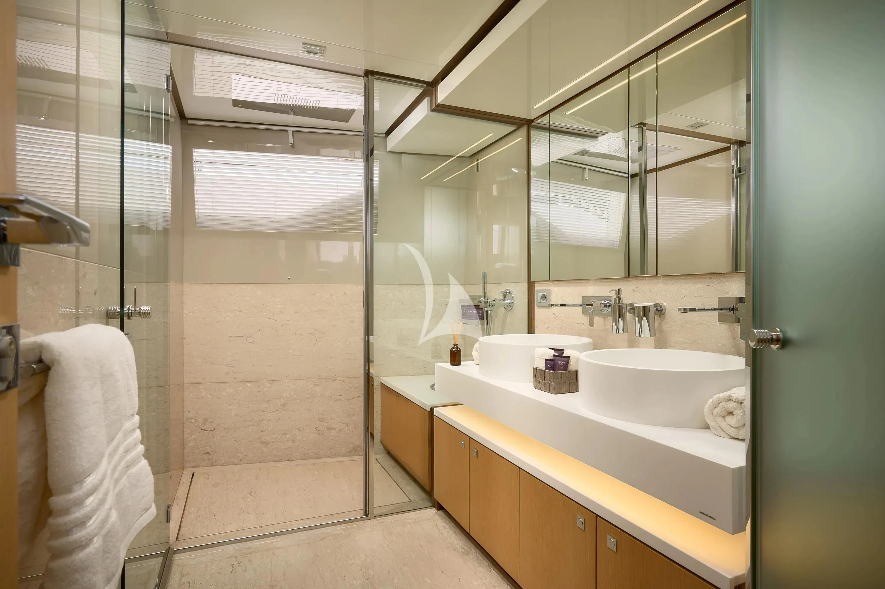 a bathroom with a glass shower aboard IVA Yacht for Sale