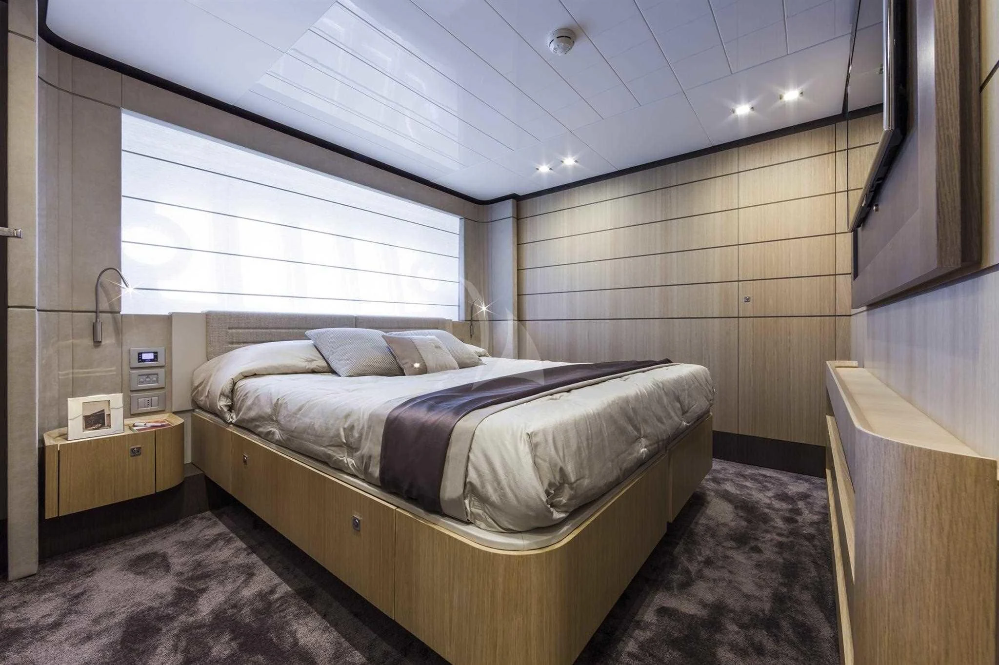 a bed in a room aboard IVA Yacht for Sale