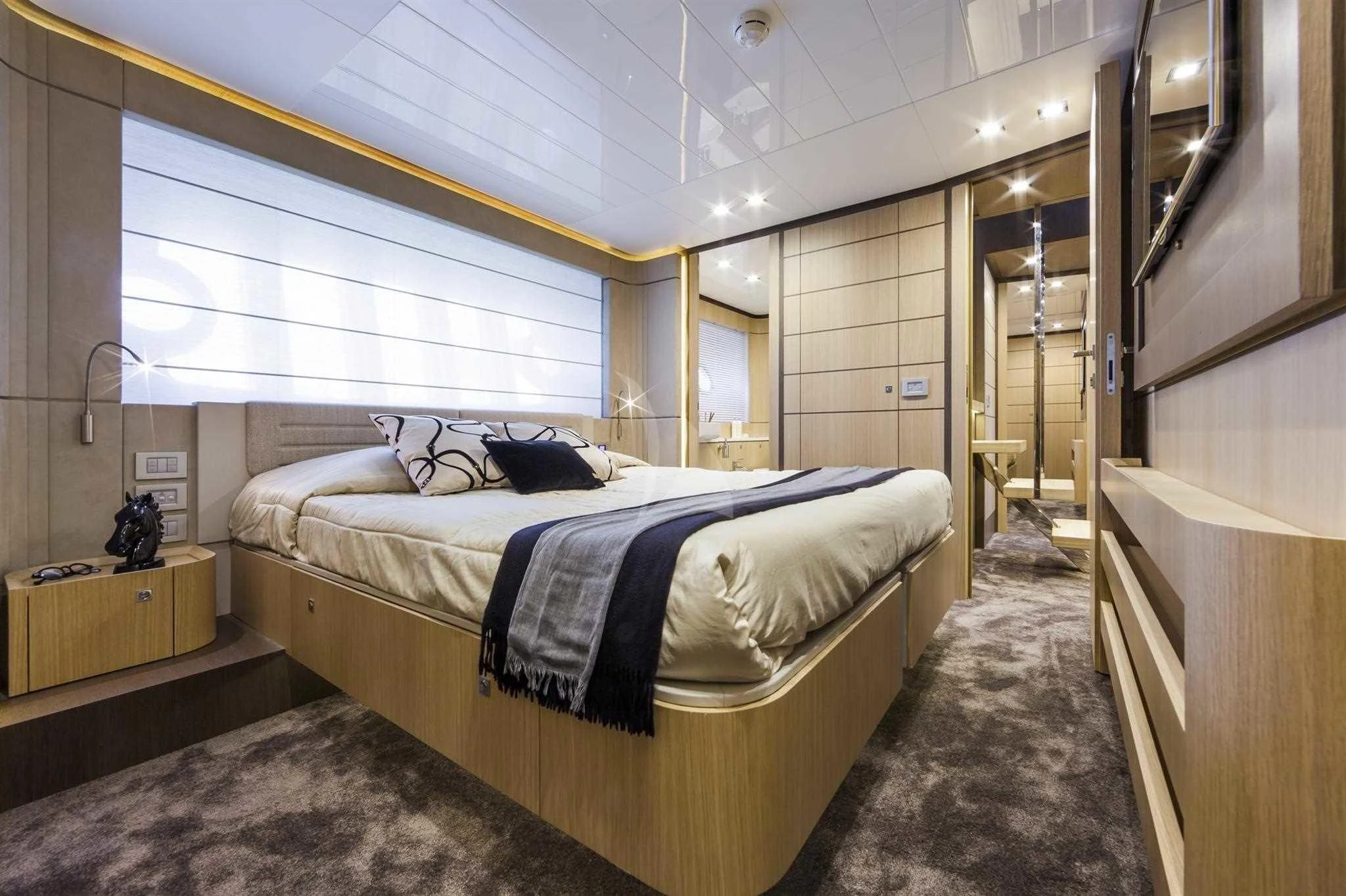 a bedroom with a bed aboard IVA Yacht for Sale