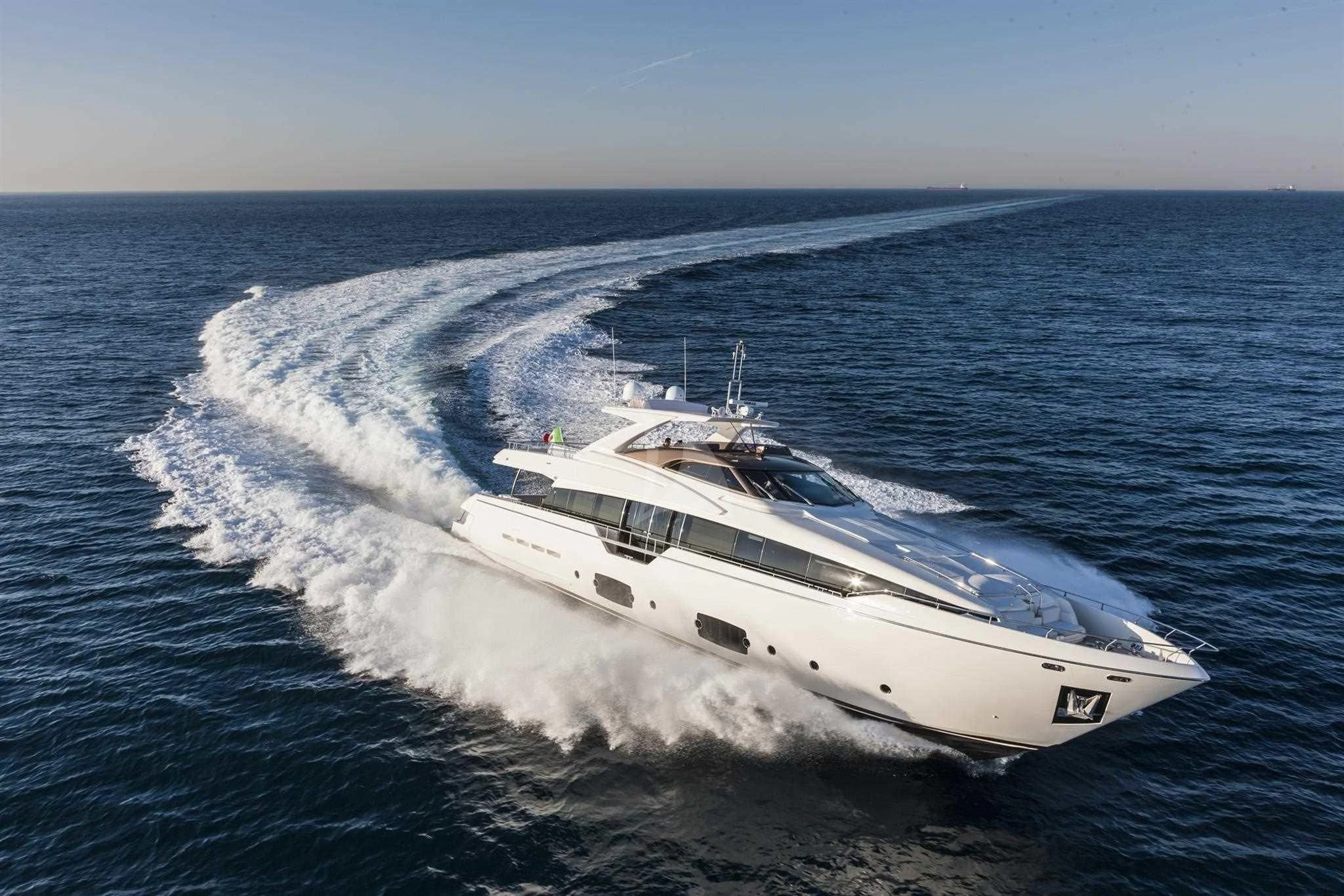 a white yacht on the water aboard IVA Yacht for Sale