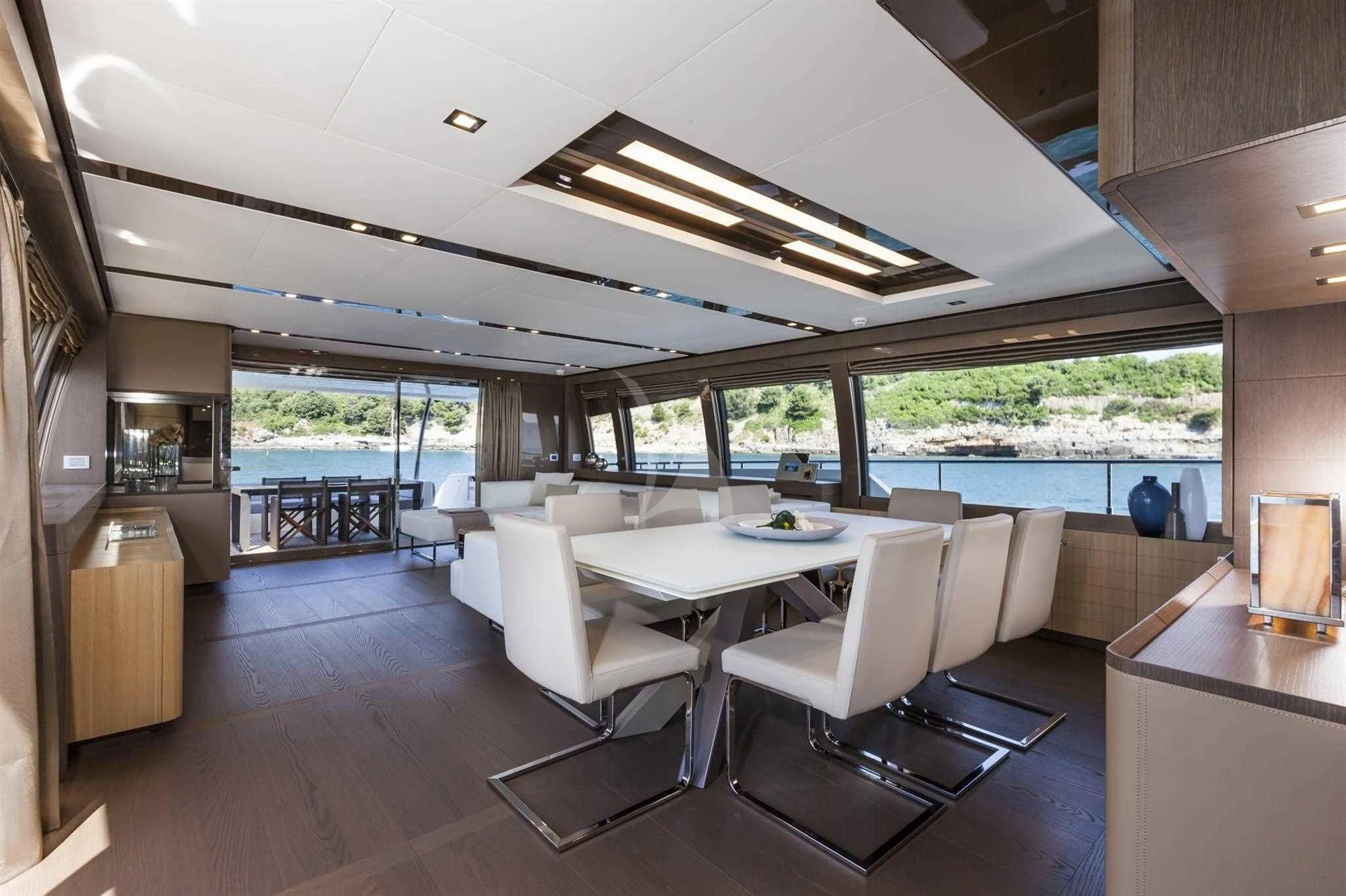 a room with a table chairs and a large window aboard IVA Yacht for Sale