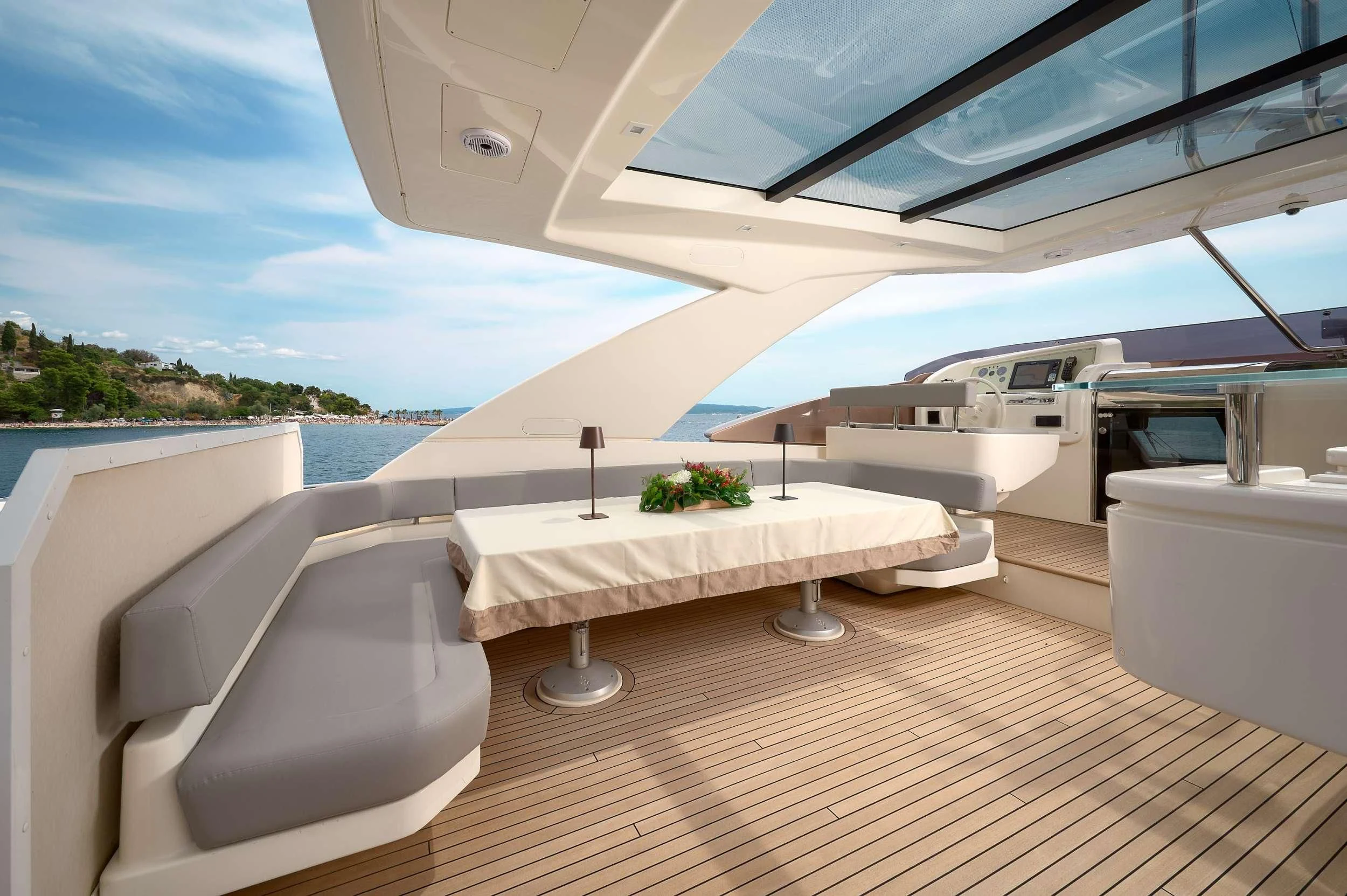 a room with a table and chairs aboard IVA Yacht for Sale