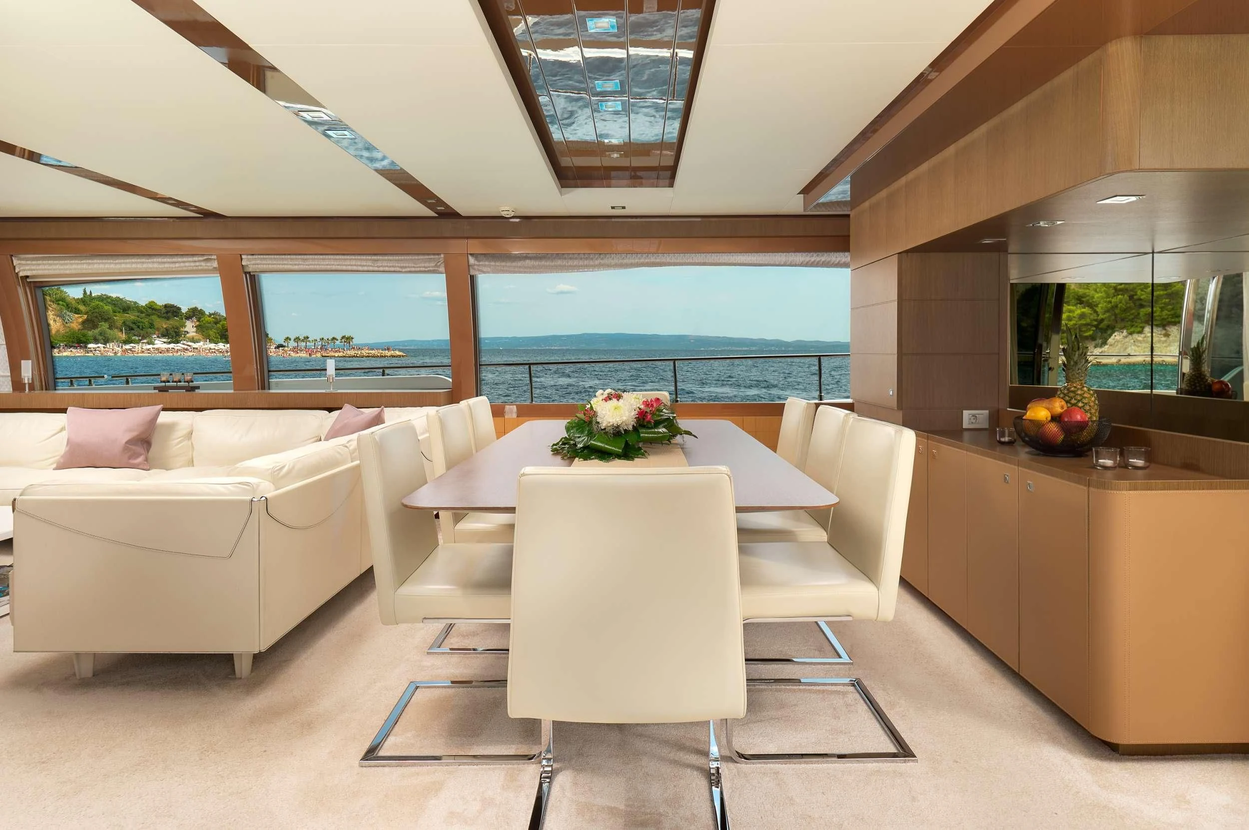 a room with a couch and a table aboard IVA Yacht for Sale