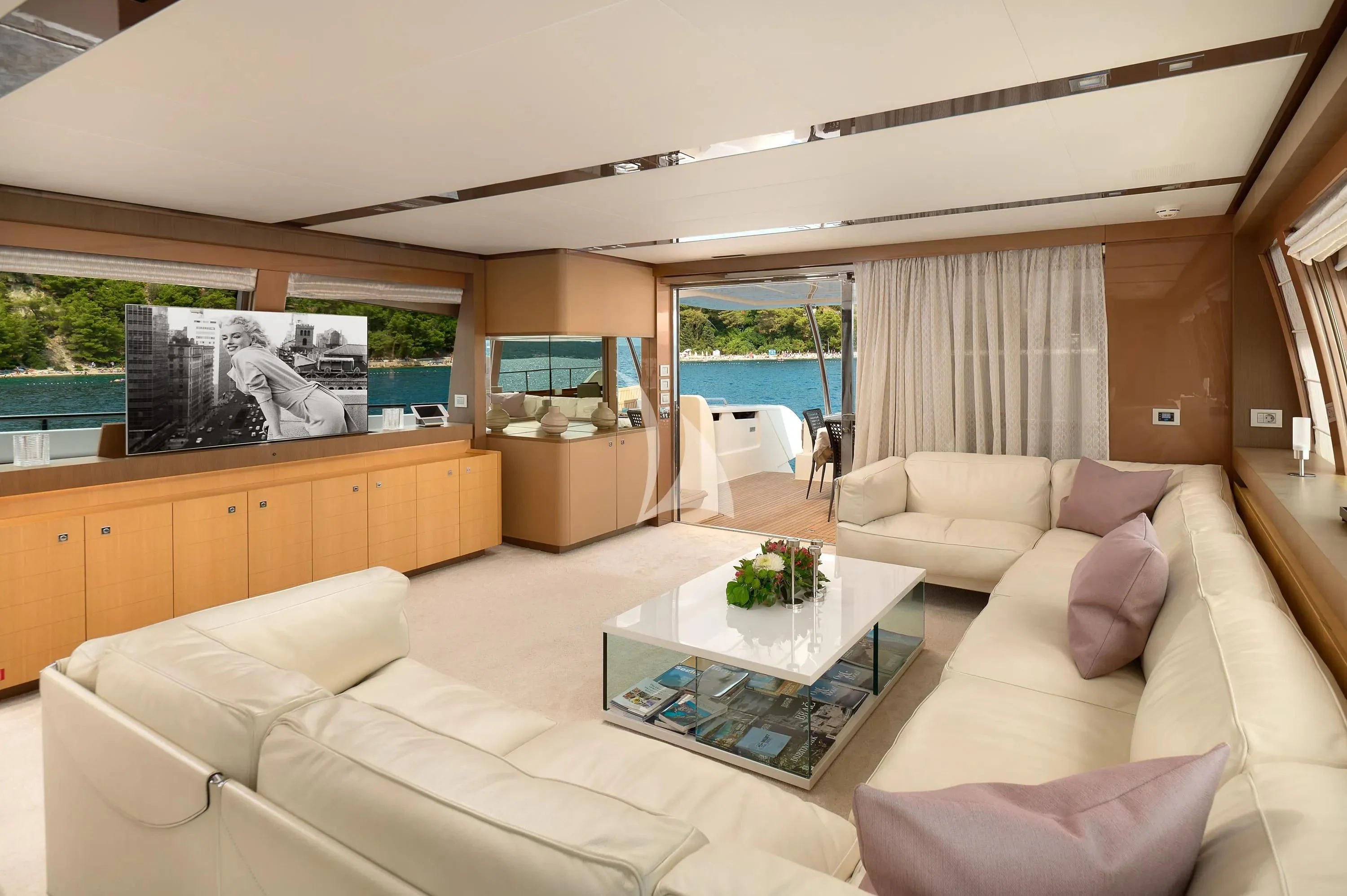 a living room with a large window aboard IVA Yacht for Sale
