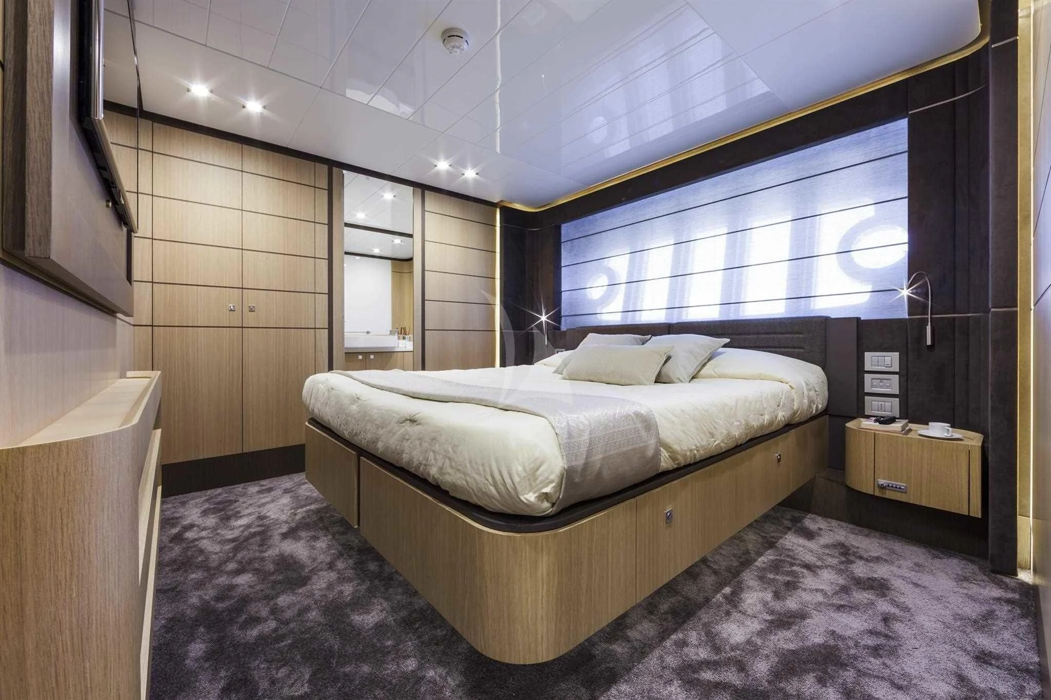 a bed in a room aboard IVA Yacht for Sale