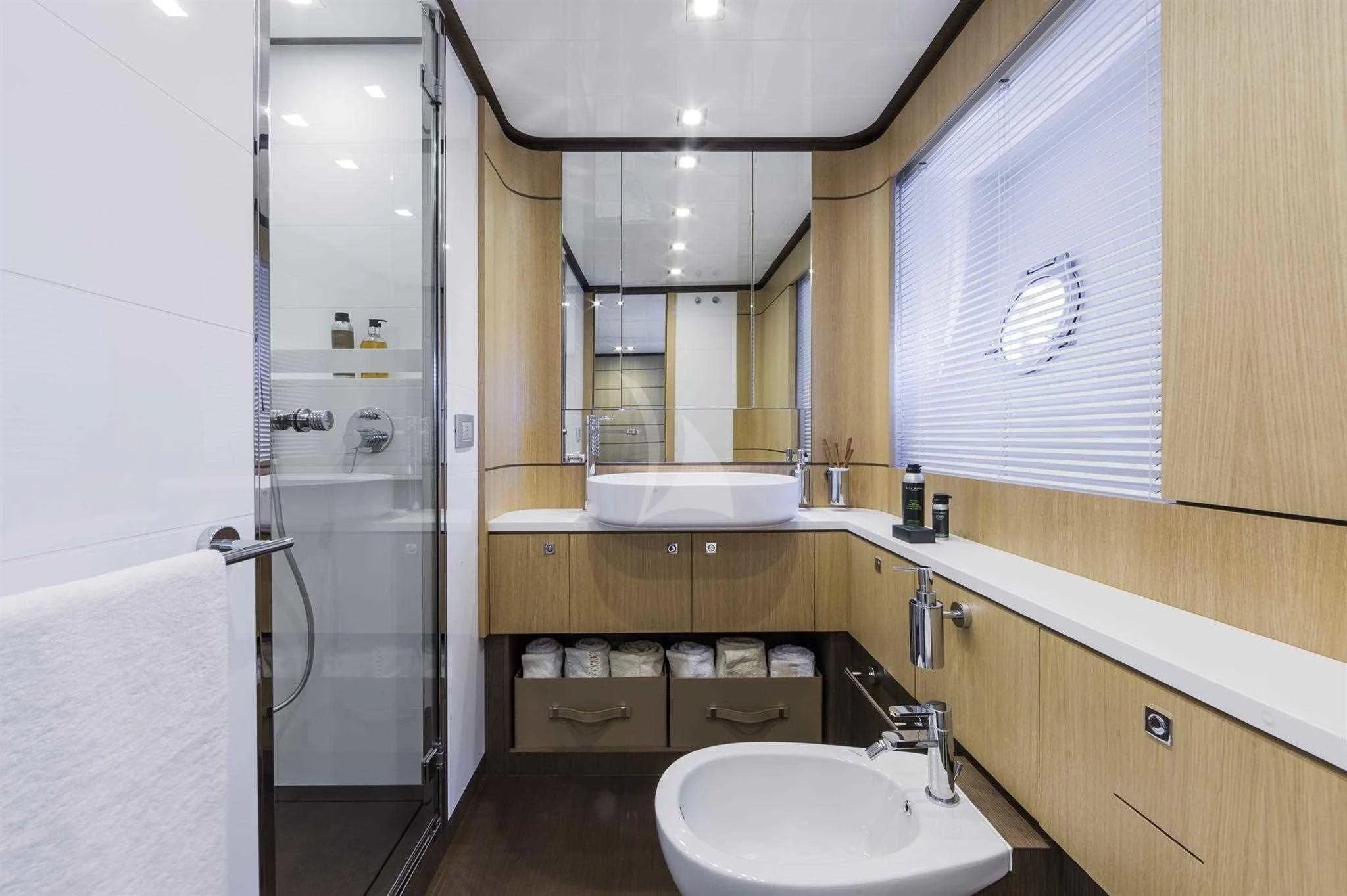 a bathroom with a sink and a mirror aboard IVA Yacht for Sale