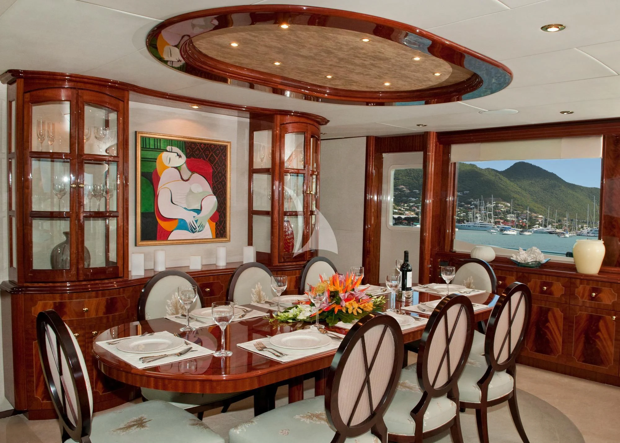 a dining room with a table and chairs aboard LE REVE Yacht for Sale