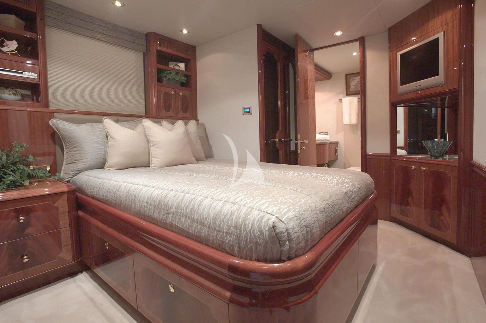 a large bed in a room aboard LE REVE Yacht for Sale
