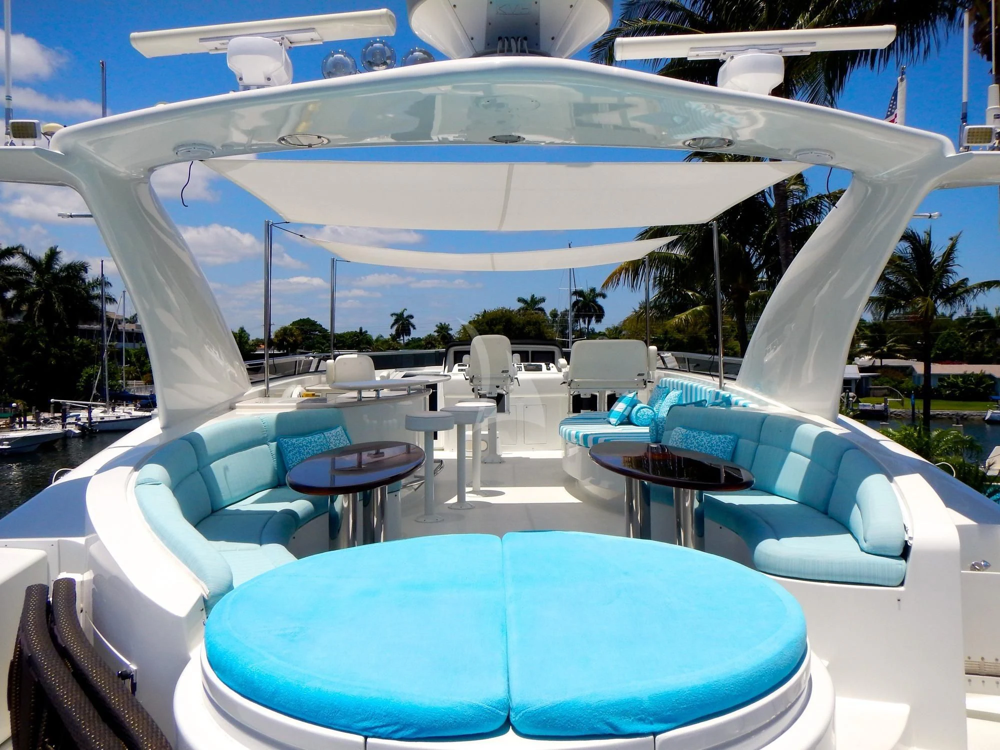 a swimming pool with a large white umbrella aboard LE REVE Yacht for Sale