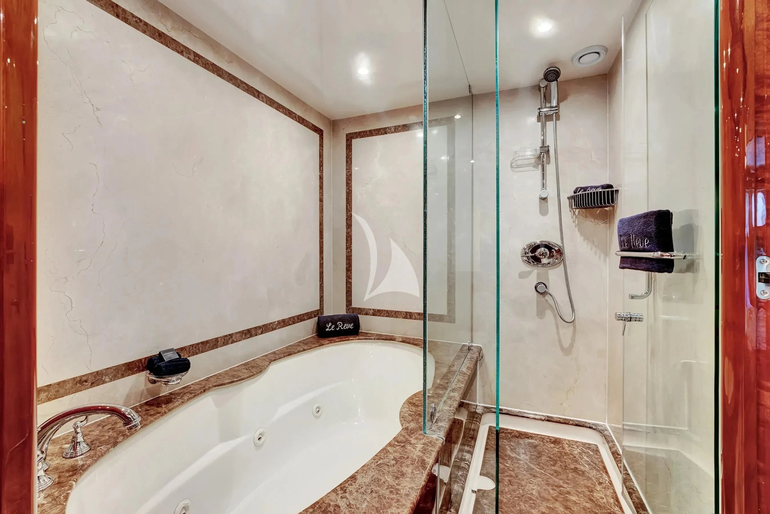 a bathroom with a tub and shower aboard LE REVE Yacht for Sale