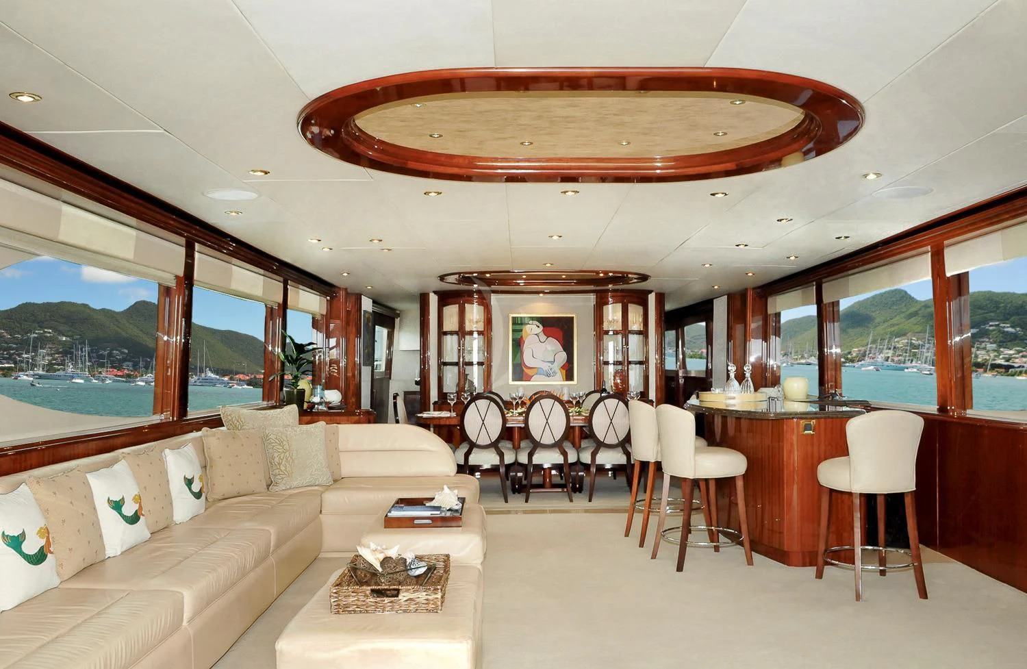 a room with a couch and a table and chairs aboard LE REVE Yacht for Sale