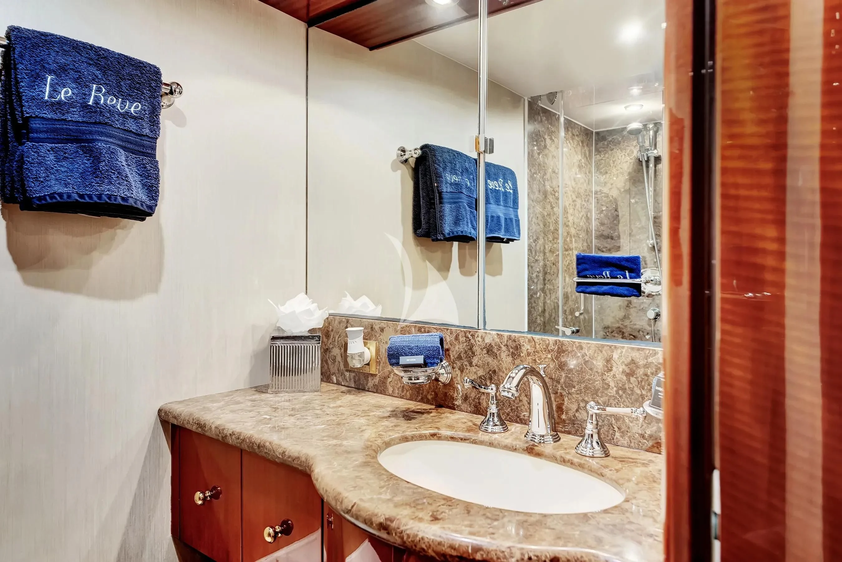 a bathroom with a sink and a mirror aboard LE REVE Yacht for Sale