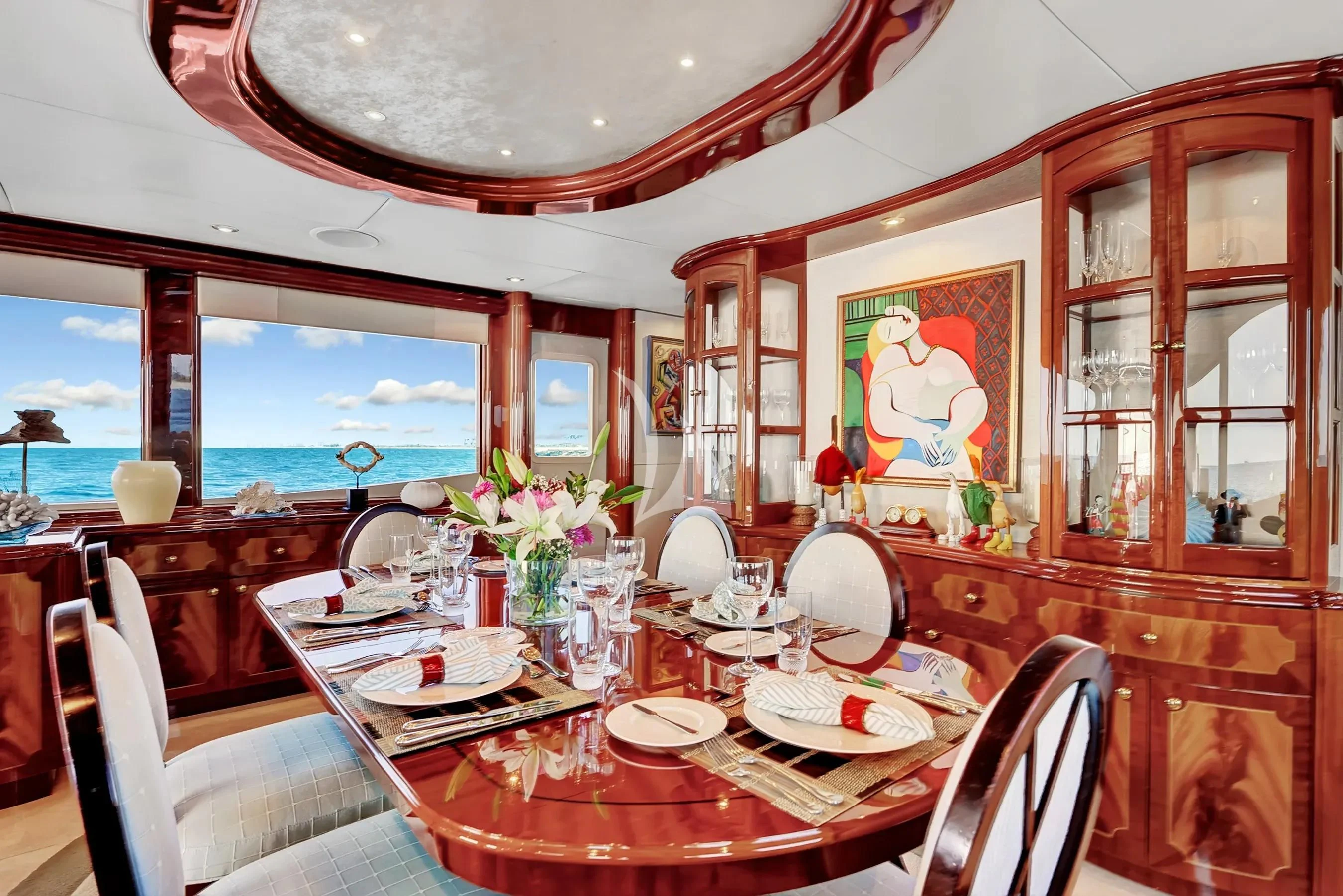 a dining room with a large window aboard LE REVE Yacht for Sale