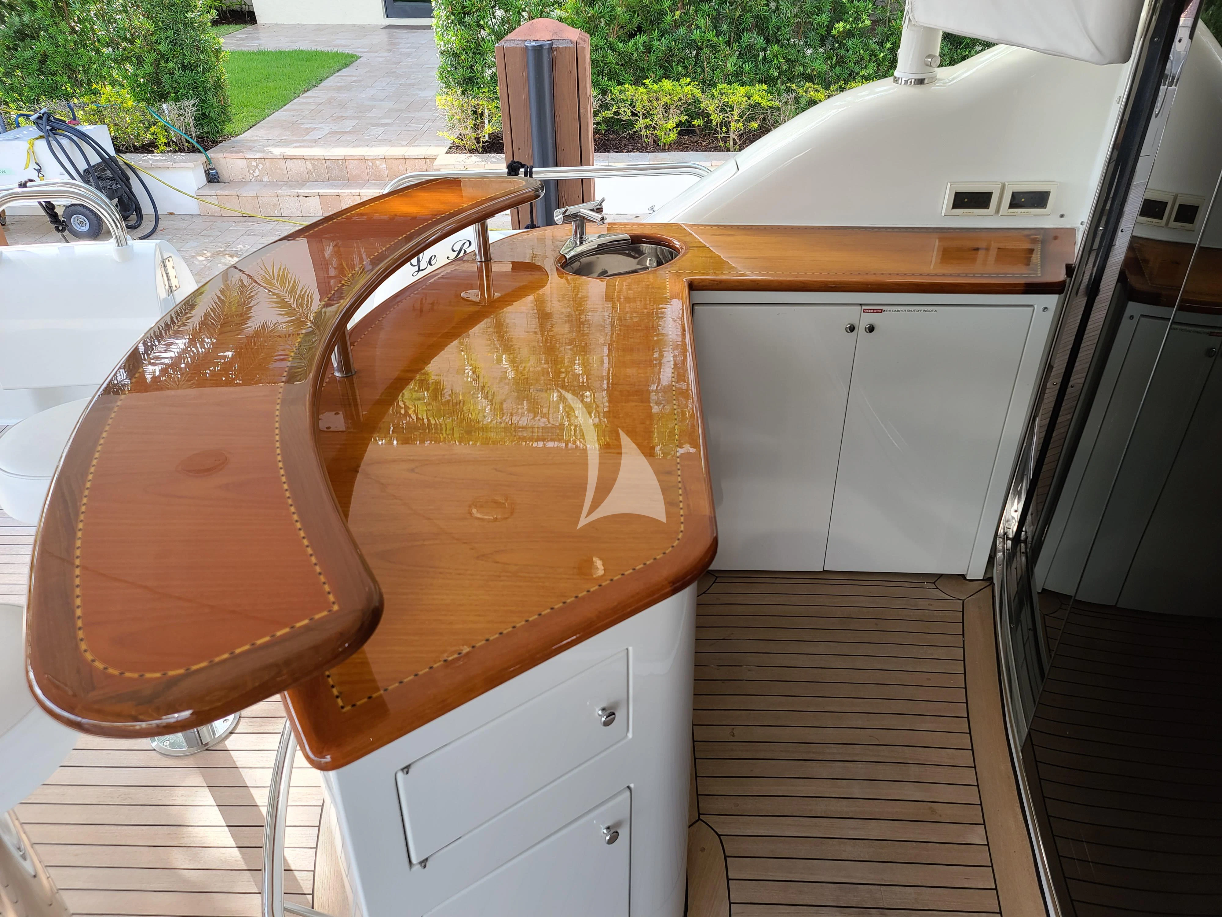 a car with a door open aboard LE REVE Yacht for Sale