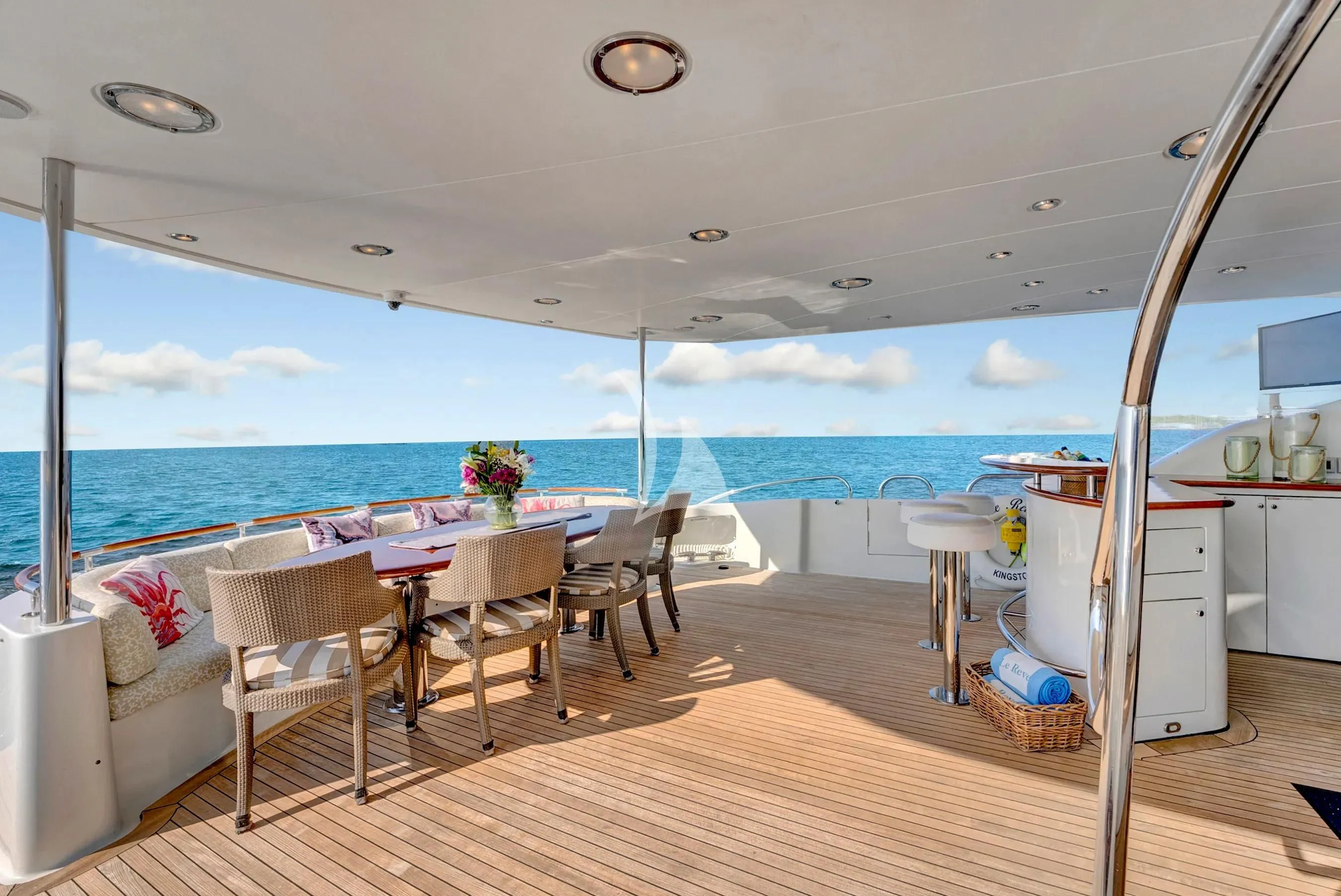 a room with a table and chairs aboard LE REVE Yacht for Sale