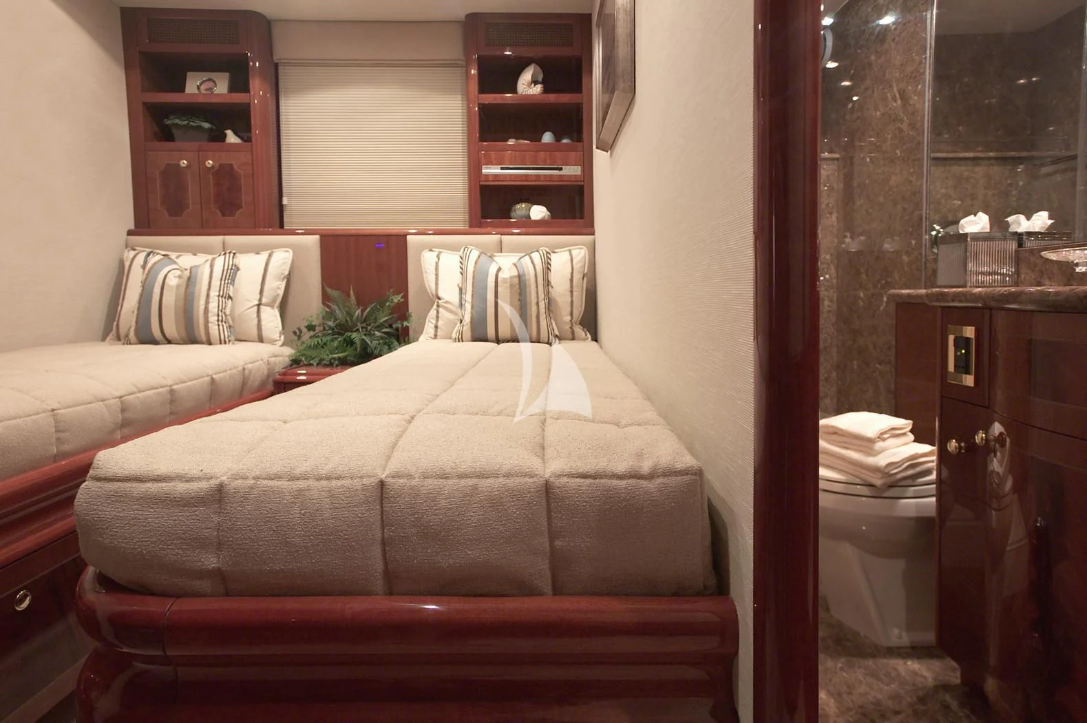 a bed in a room aboard LE REVE Yacht for Sale