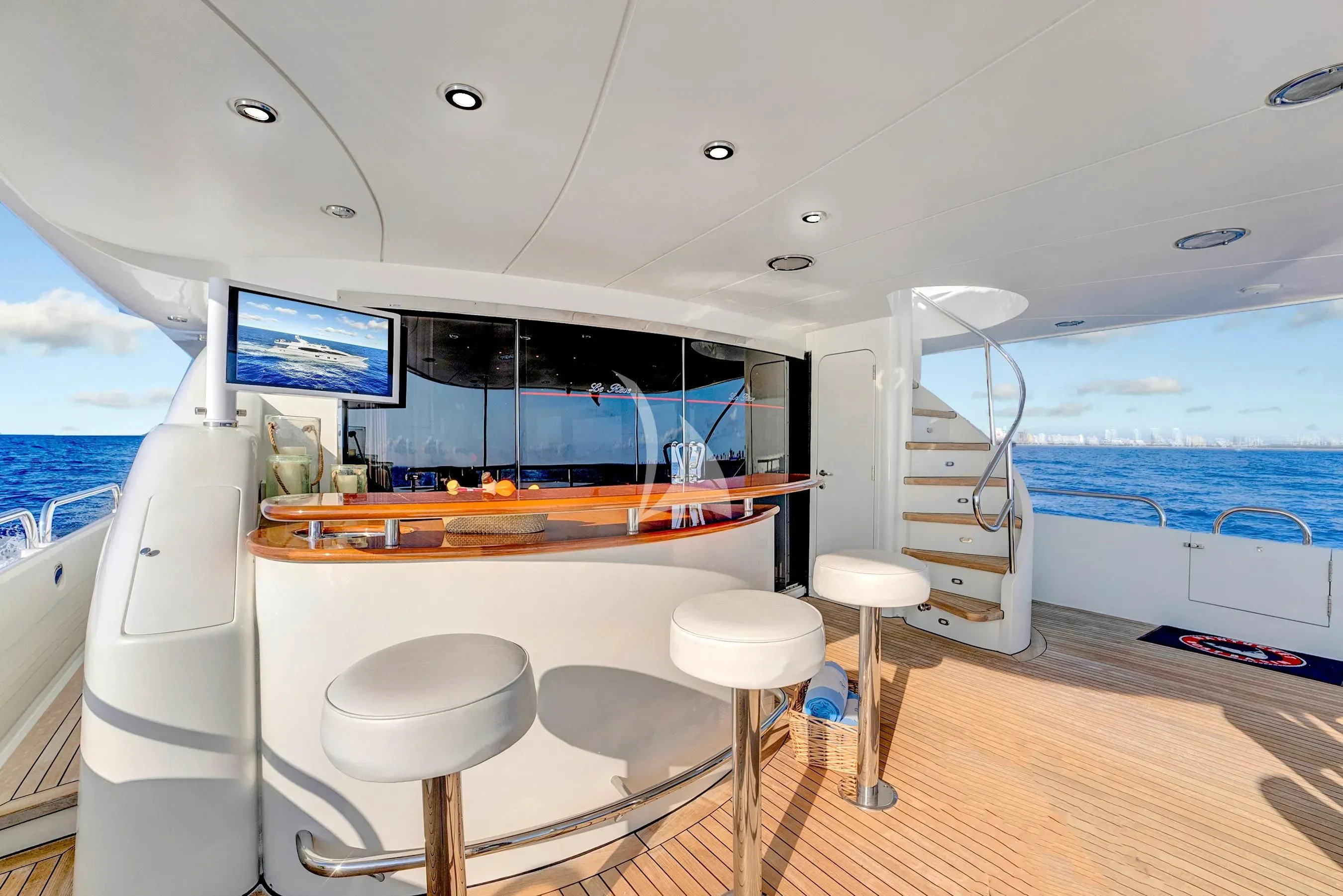 a boat with stools and stools aboard LE REVE Yacht for Sale