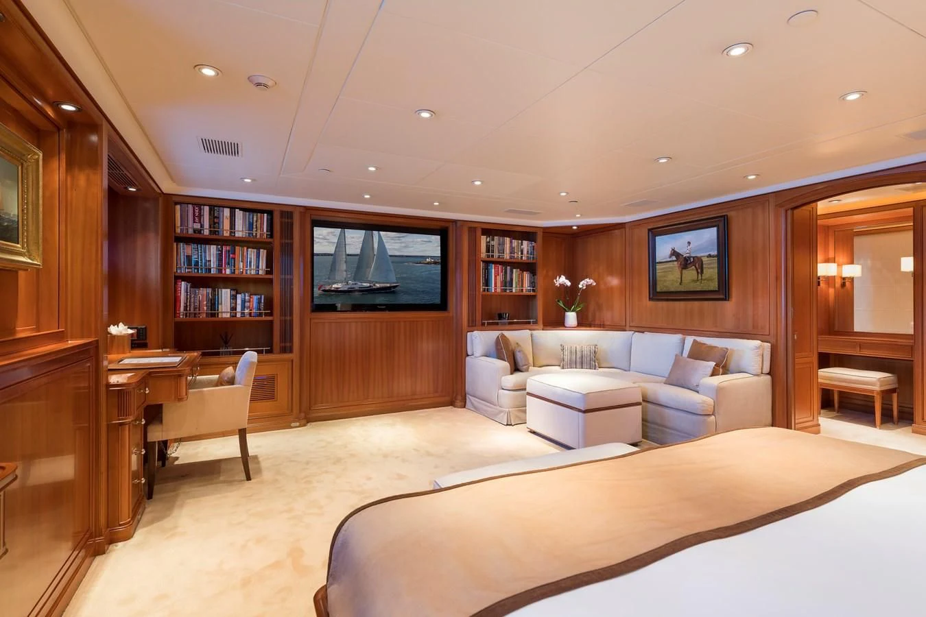 a large living room with a large tv aboard ZENJI Yacht for Sale