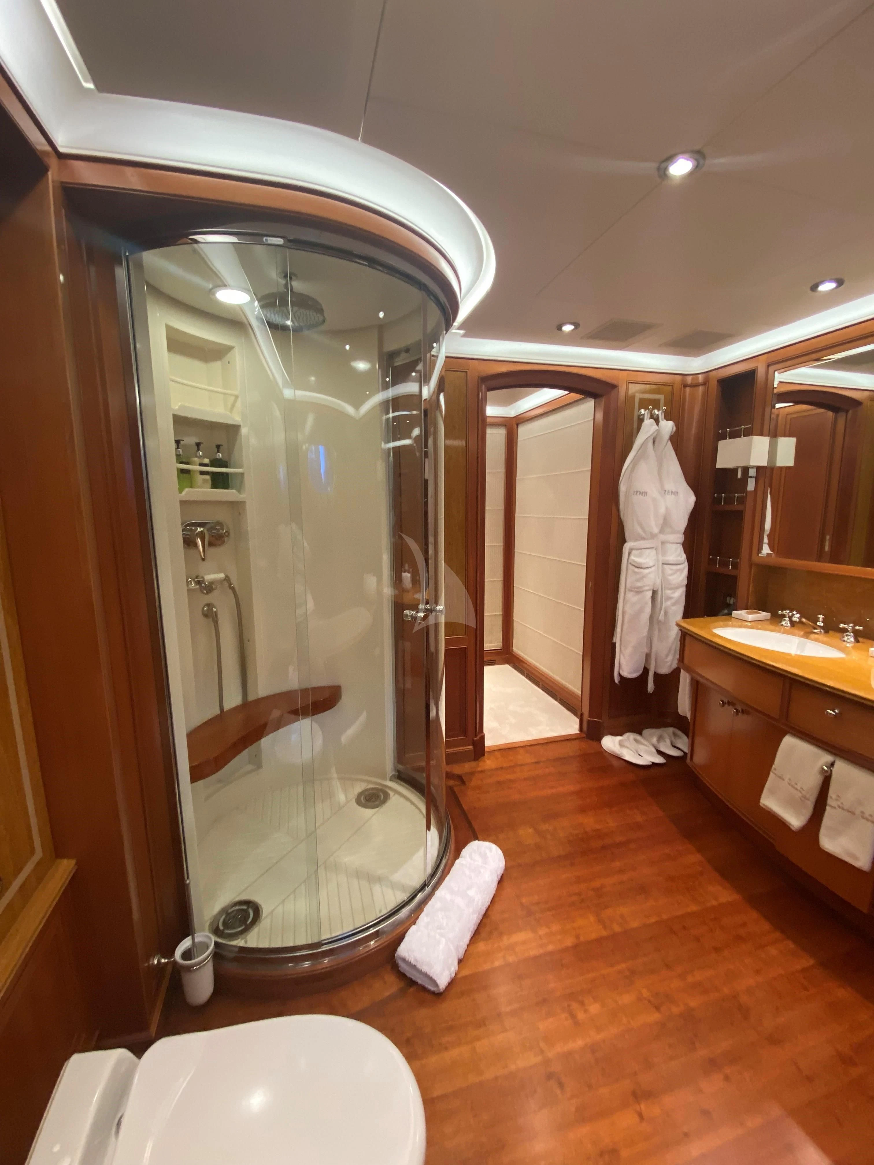 a bathroom with a large mirror aboard ZENJI Yacht for Sale