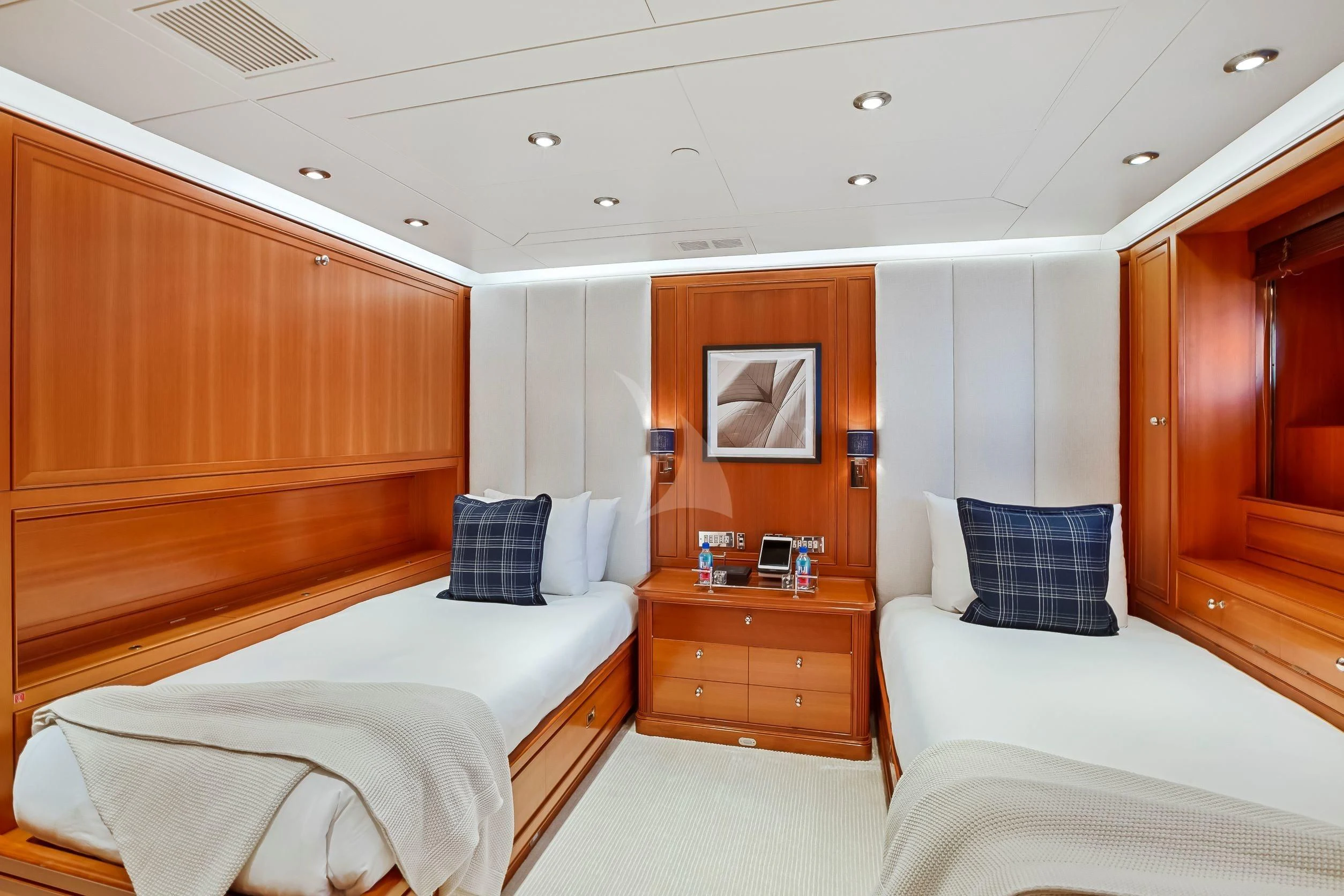 a room with a bed and a desk aboard ZENJI Yacht for Sale