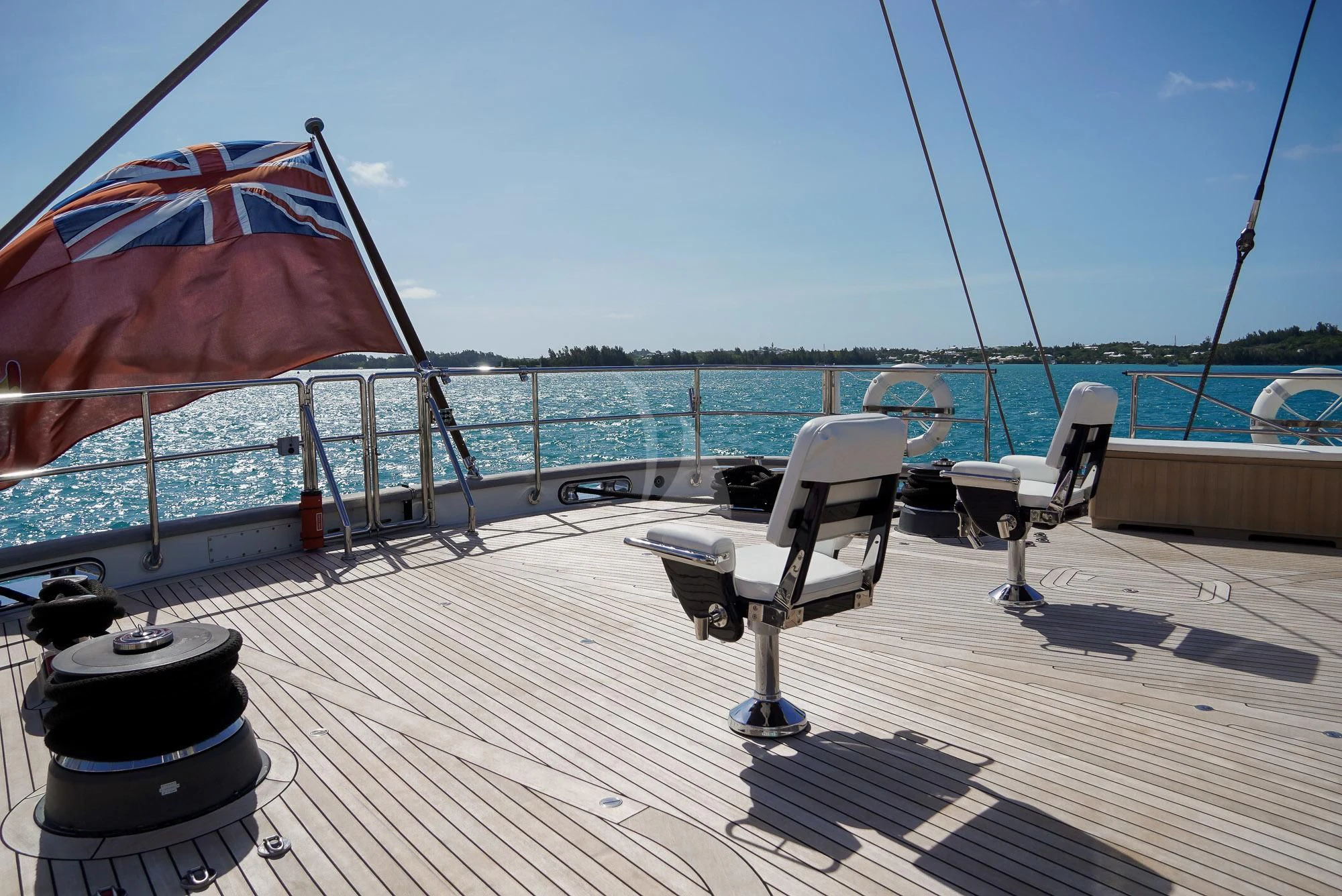 a deck with chairs and umbrellas aboard ZENJI Yacht for Sale