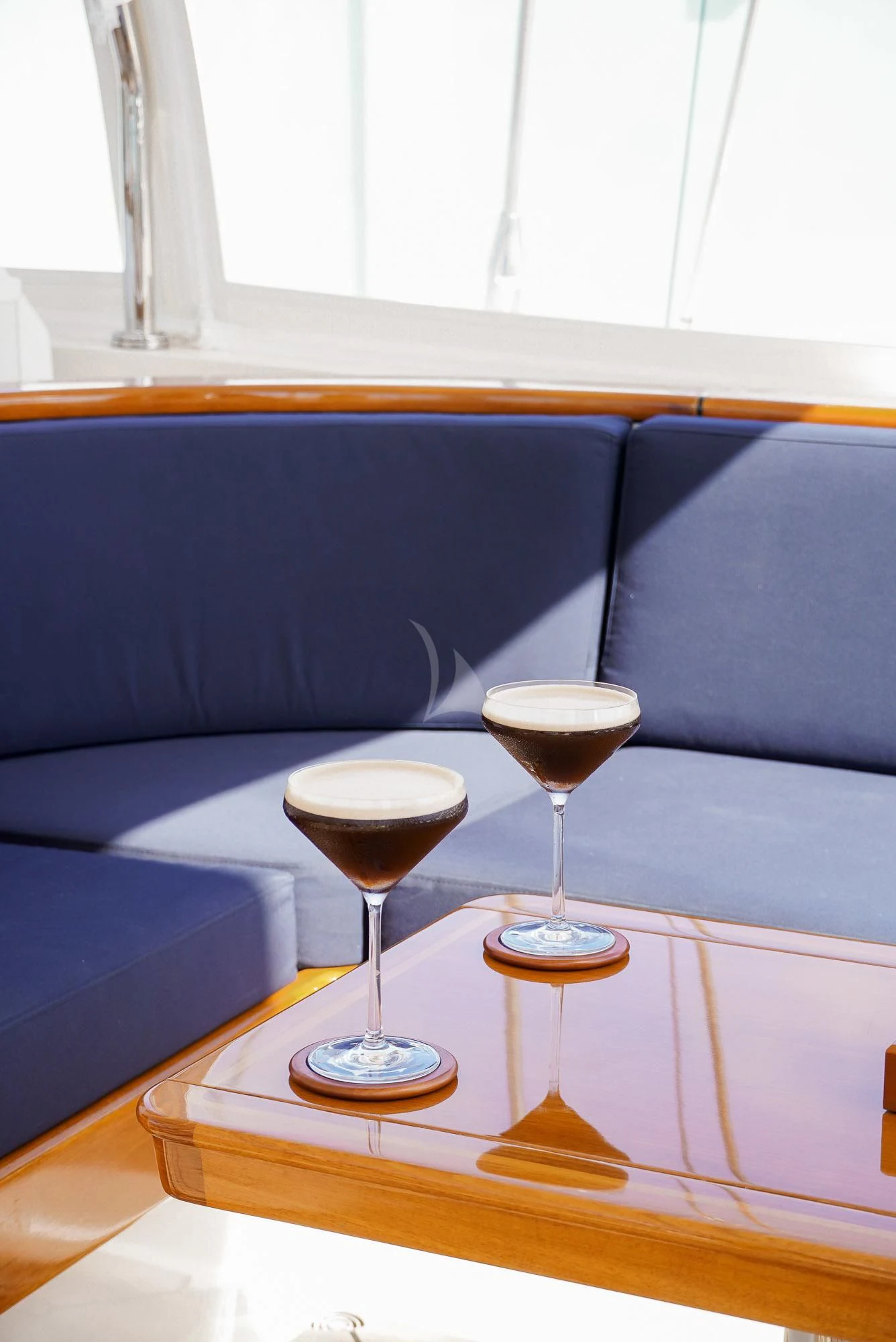 glasses of wine on a table aboard ZENJI Yacht for Sale