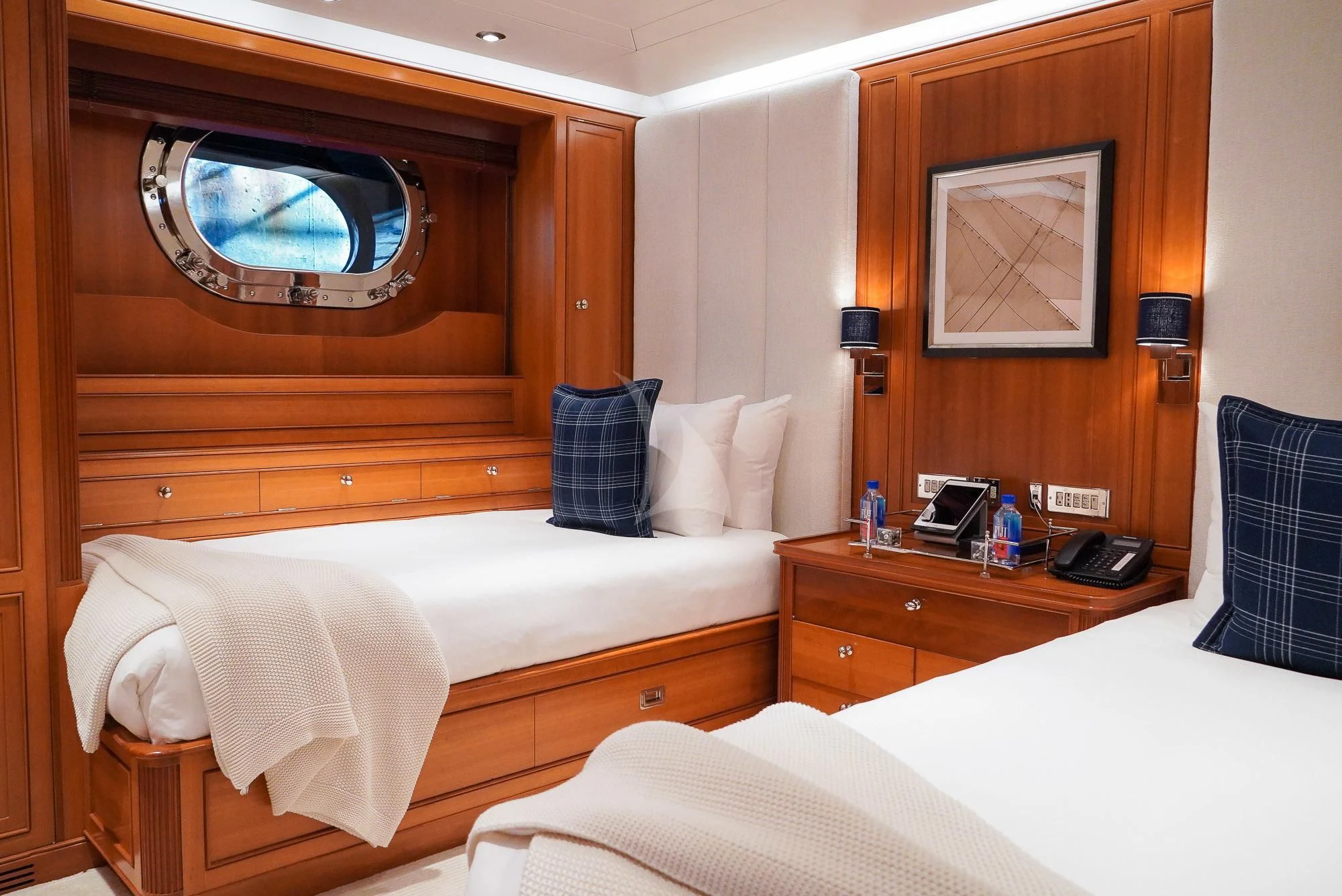 a hotel room with two beds aboard ZENJI Yacht for Sale