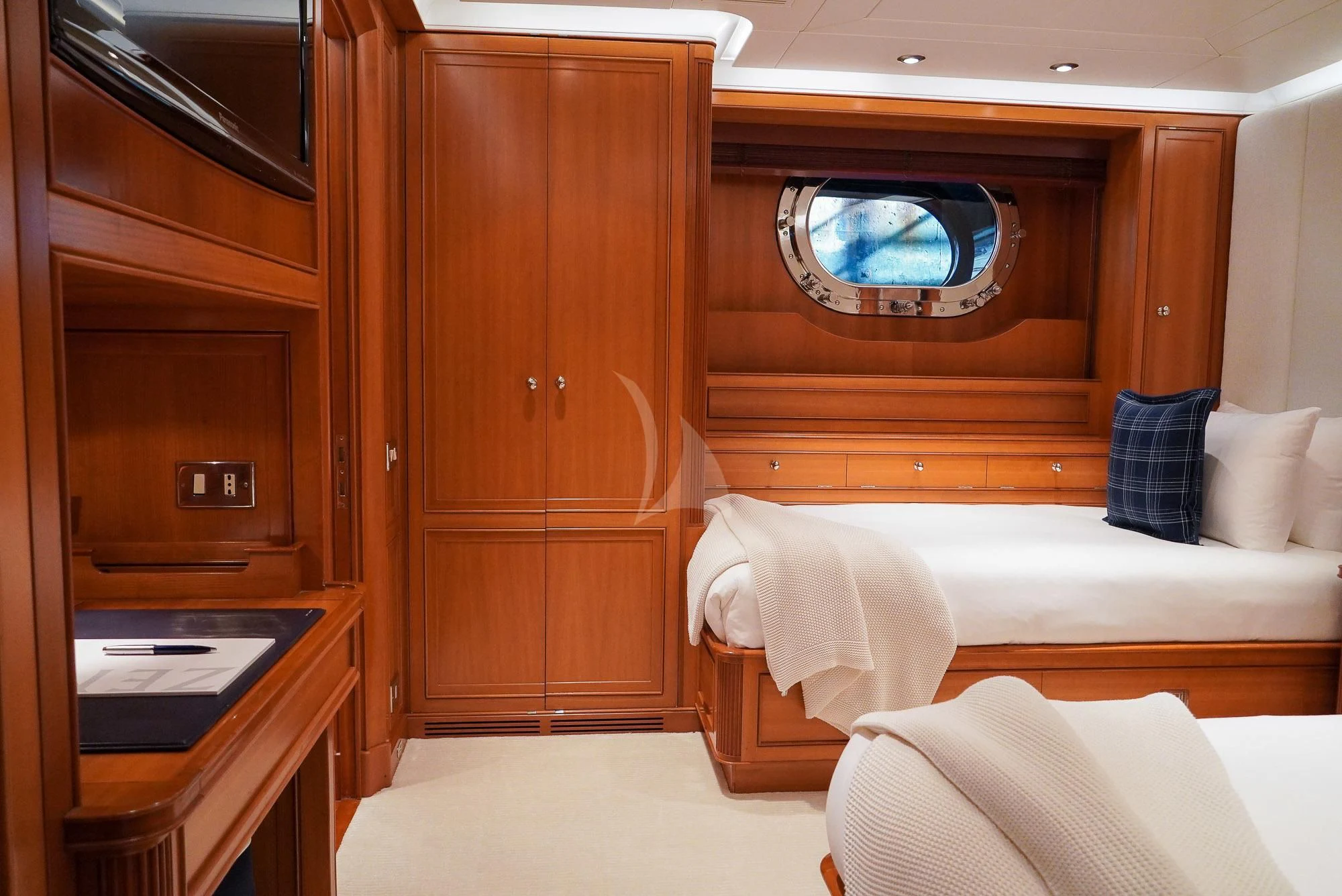 a room with a bed and a desk aboard ZENJI Yacht for Sale