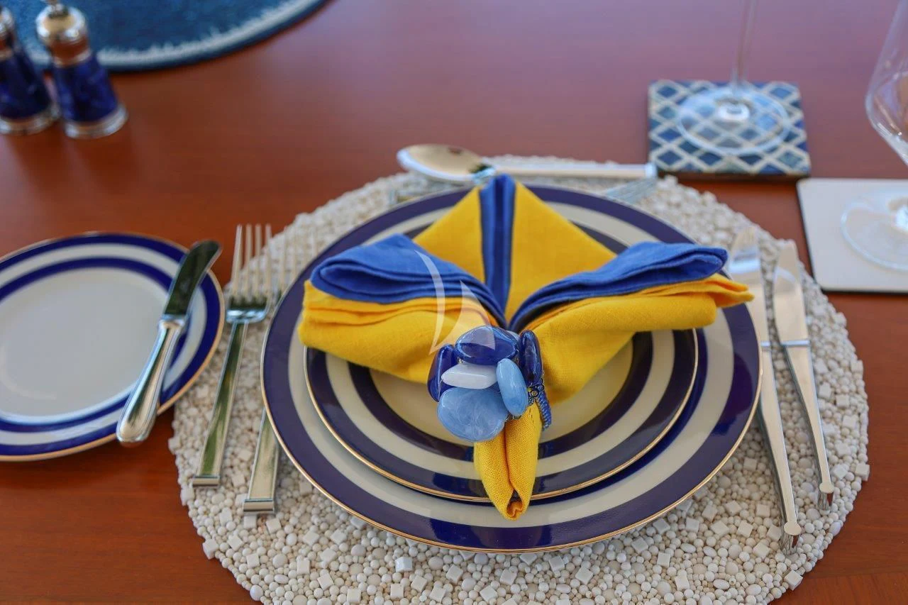 a cake on a plate aboard ZENJI Yacht for Sale