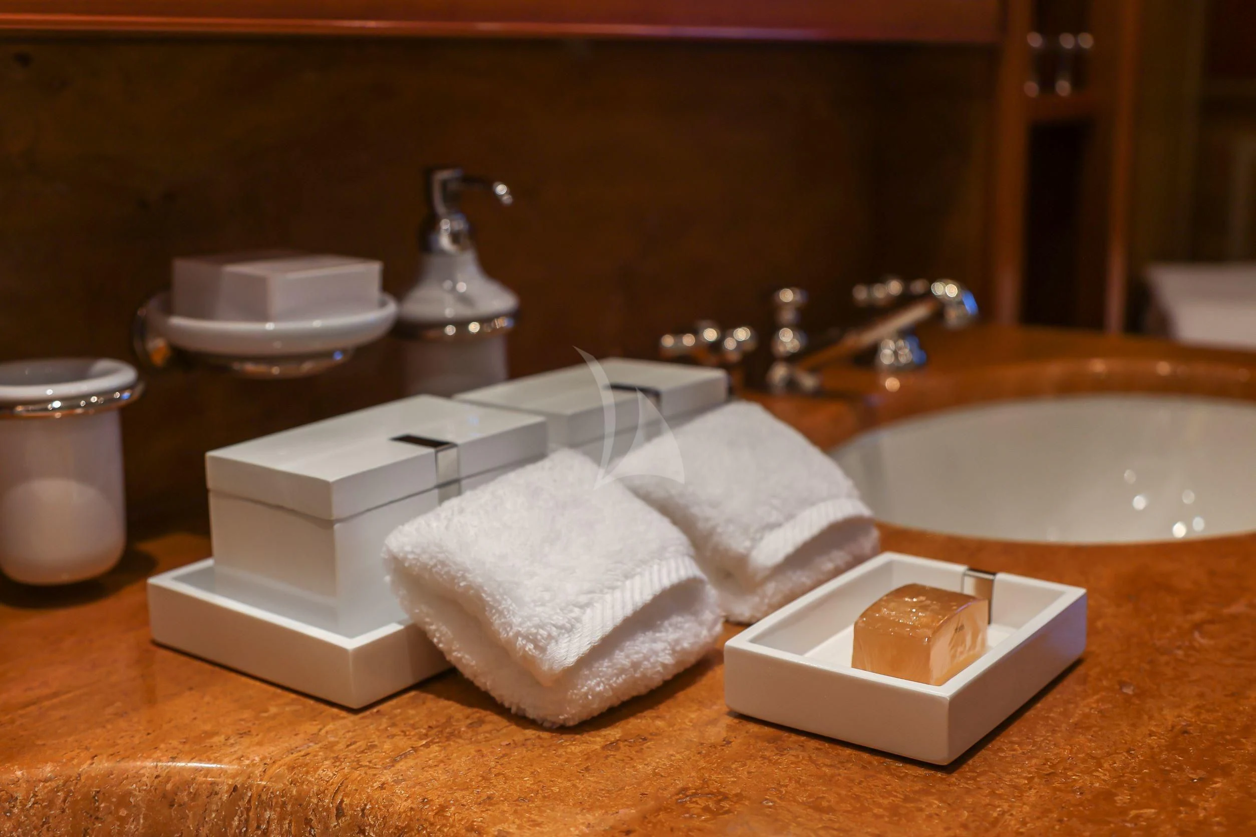 a countertop with a towel and toiletries on it aboard ZENJI Yacht for Sale