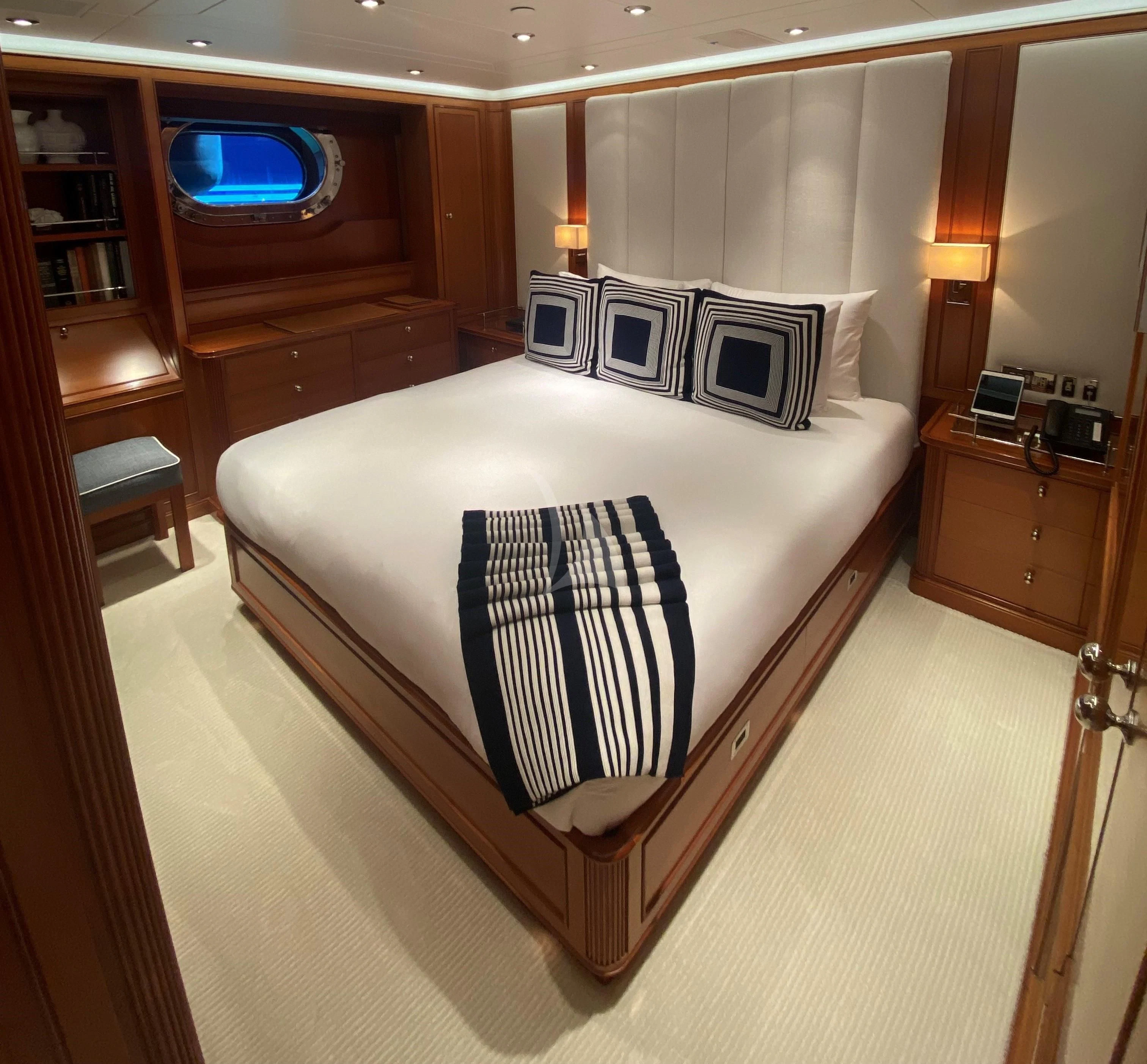 a bed in a room aboard ZENJI Yacht for Sale
