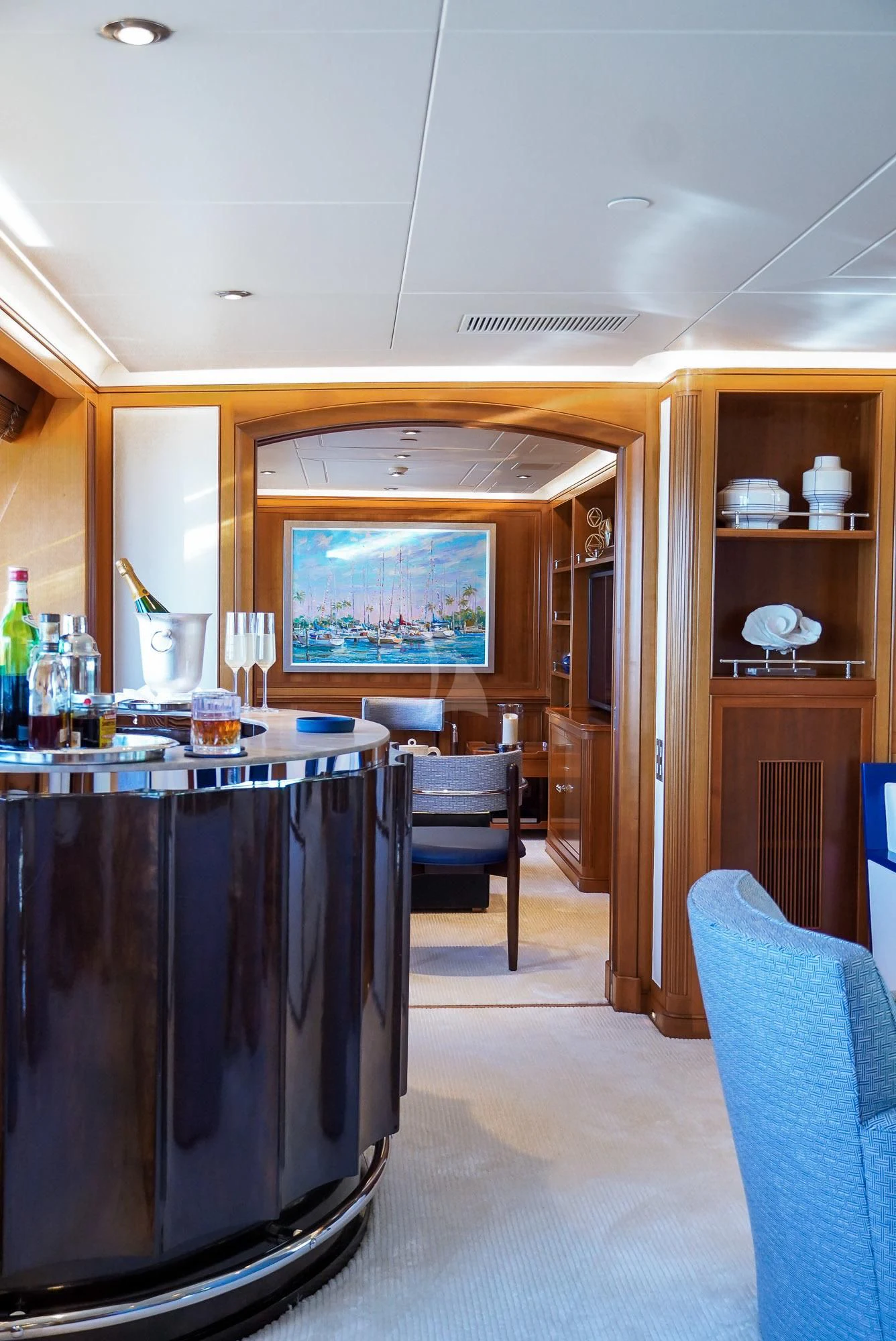 a kitchen with a large black refrigerator aboard ZENJI Yacht for Sale