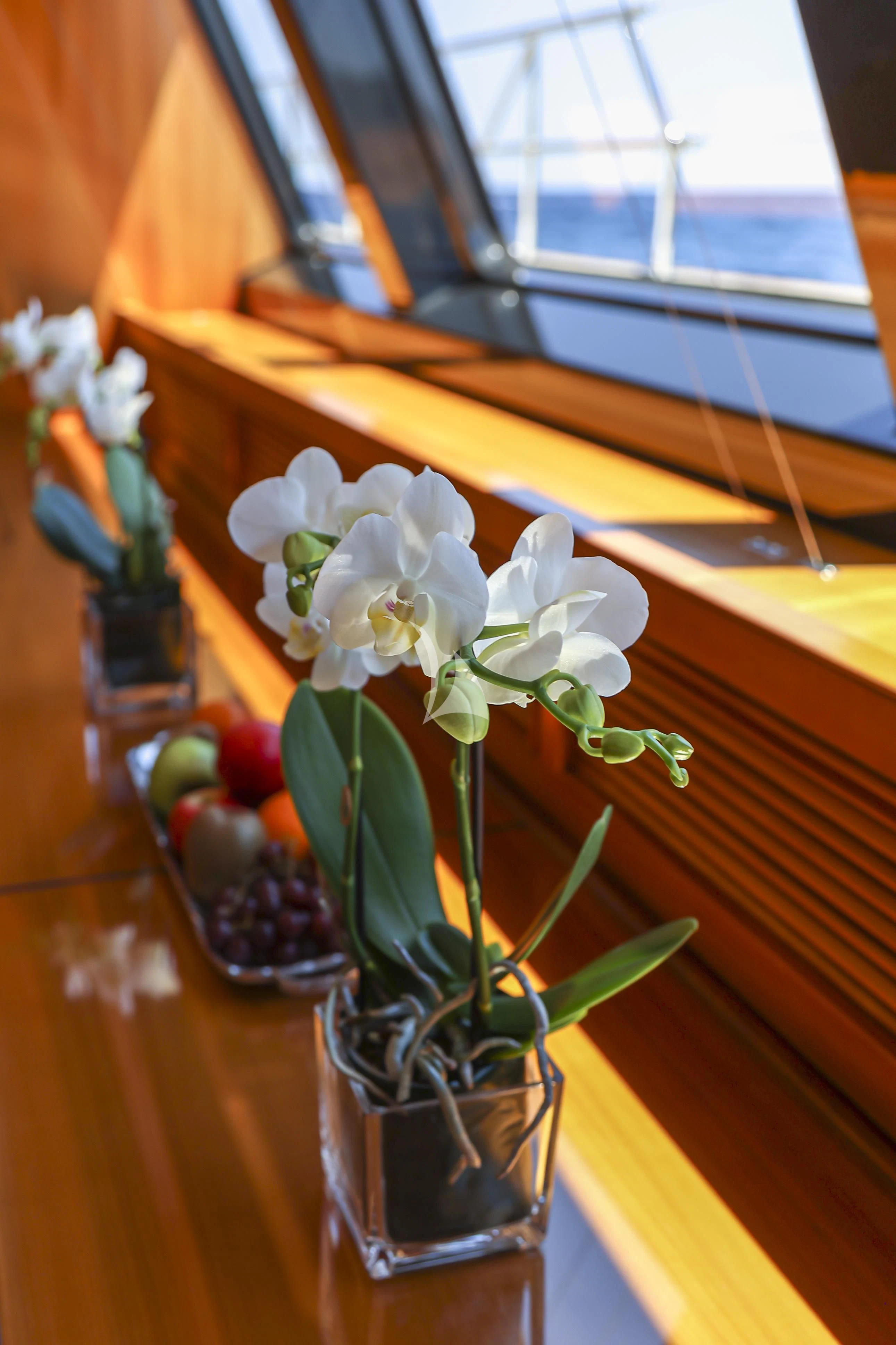 a vase with white flowers aboard ZENJI Yacht for Sale