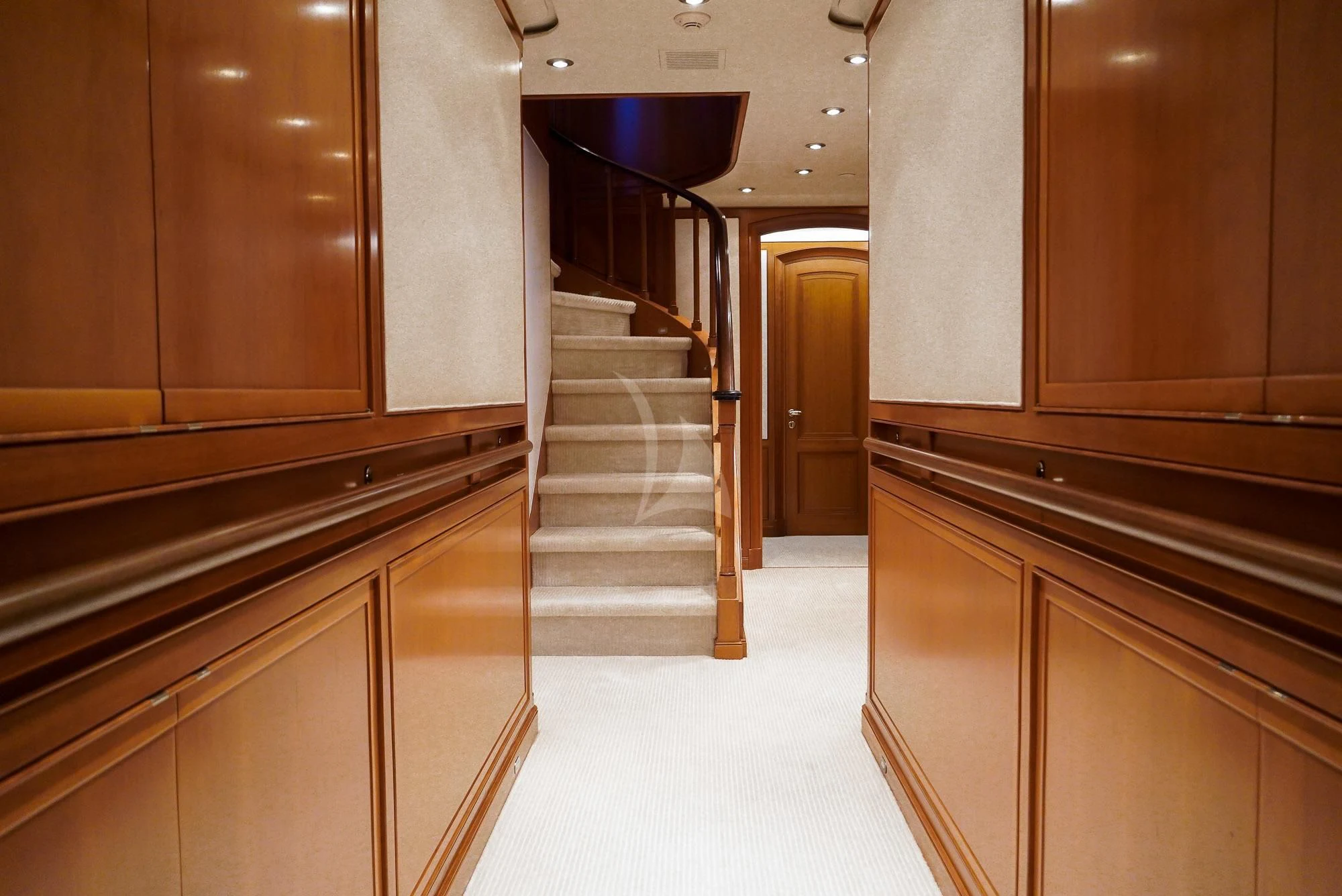 a hallway with a staircase and cabinets aboard ZENJI Yacht for Sale