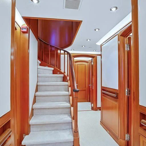 a long hallway with doors aboard ZENJI Yacht for Sale