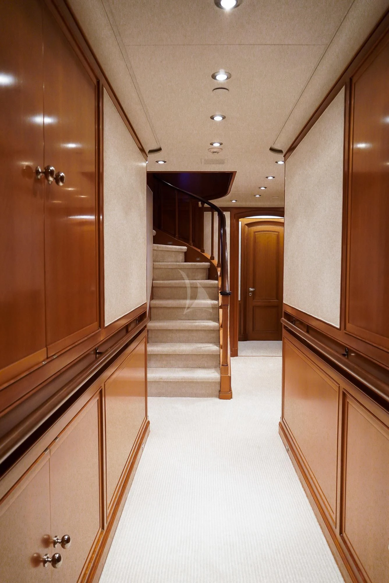 a hallway with a large wood door aboard ZENJI Yacht for Sale