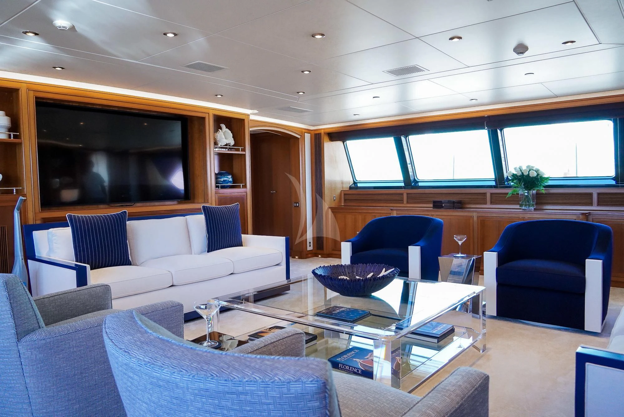 a living room with a couch and a table aboard ZENJI Yacht for Sale