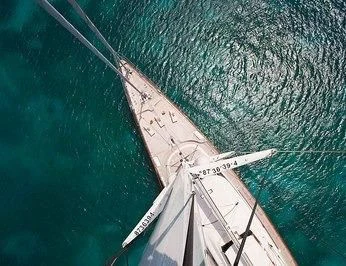 a large white boat in the water aboard ZENJI Yacht for Sale